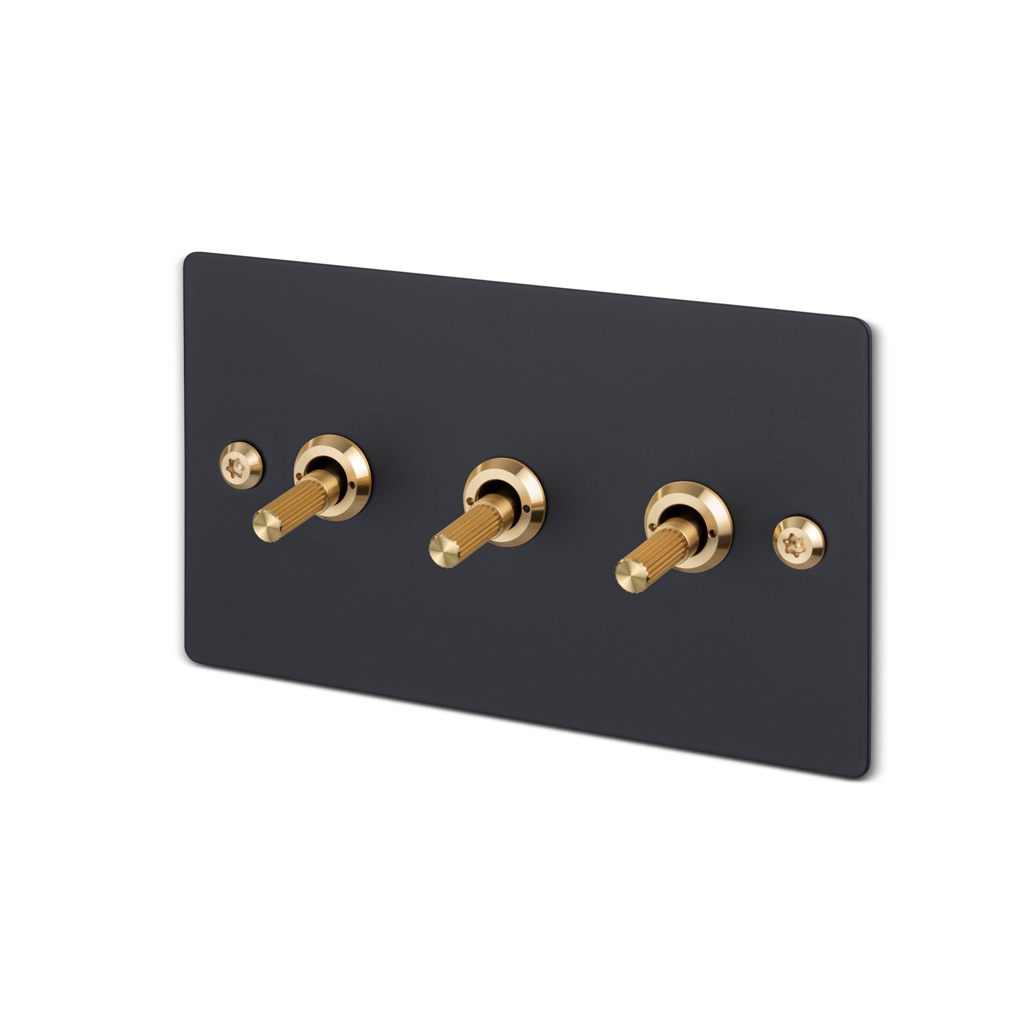 Buster + Punch 3G toggle switch, Black plate with Brass linear knurl toggle arm, isolated cutout