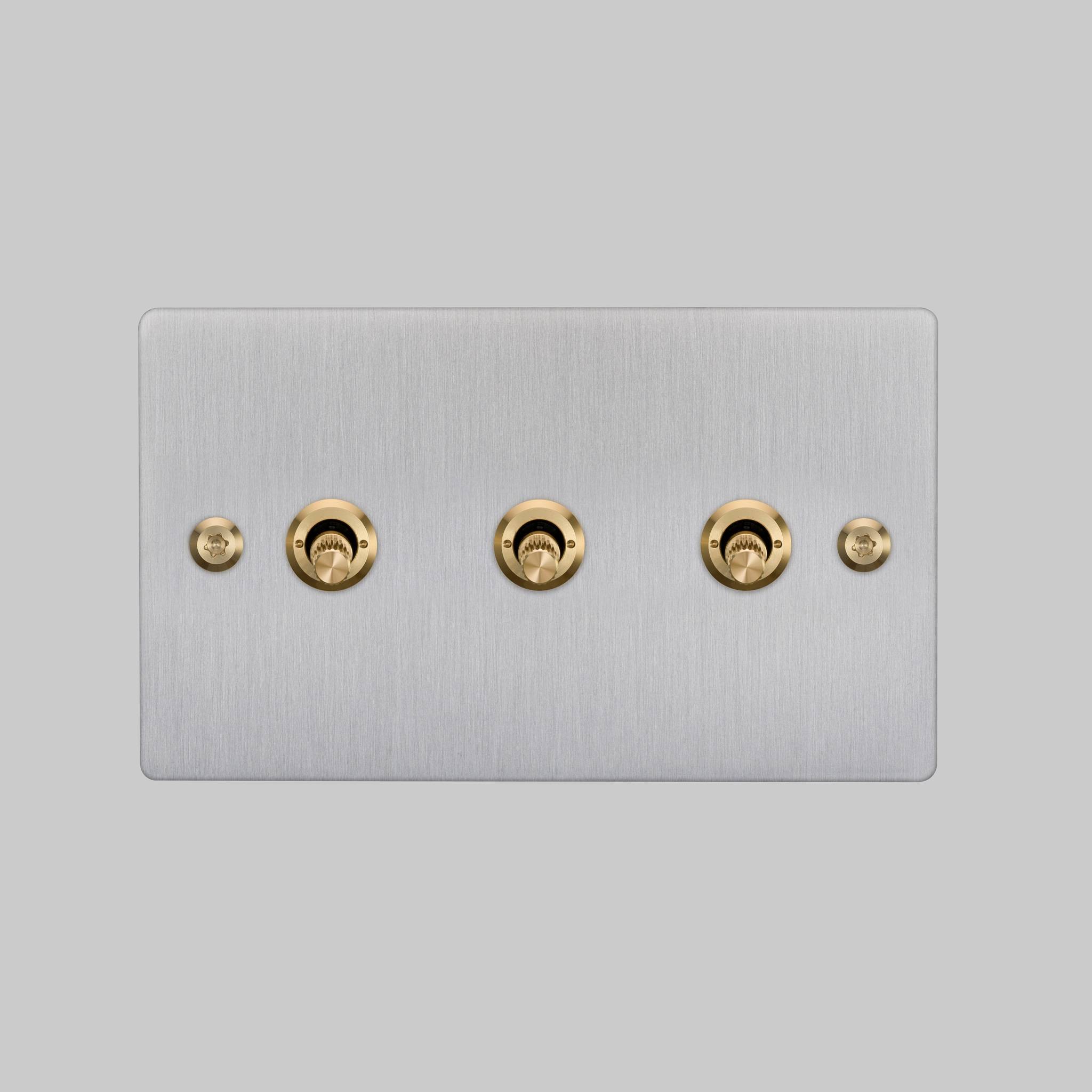 Buster + Punch 3G 2-way toggle switch, Steel plate with Brass linear knurl toggle arm, elevated angle