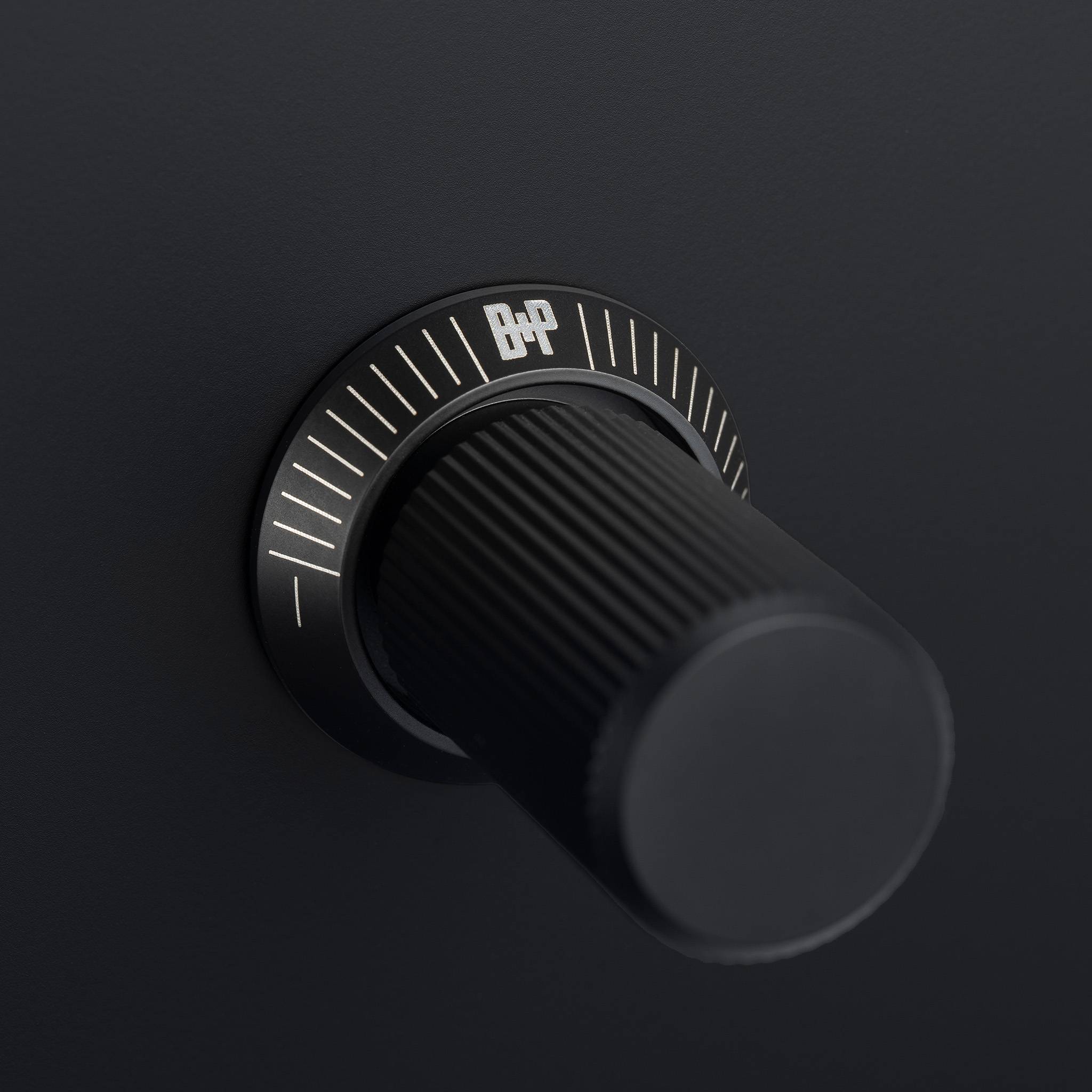 Buster + Punch 1G dimmer switch, close up of the black linear knurl knob detail