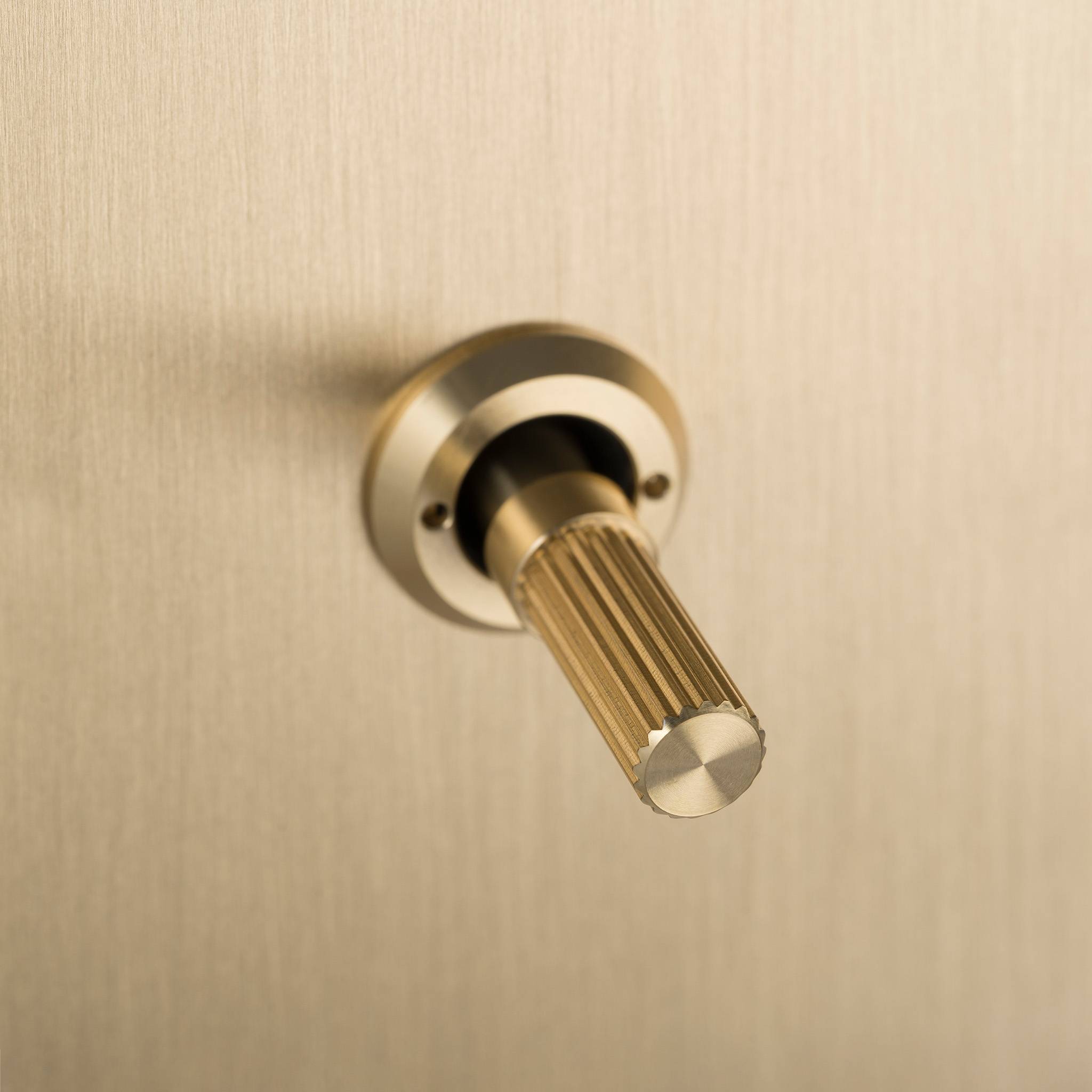 Buster + Punch 3G toggle switch, close up of the Brass linear knurl toggle arm detail