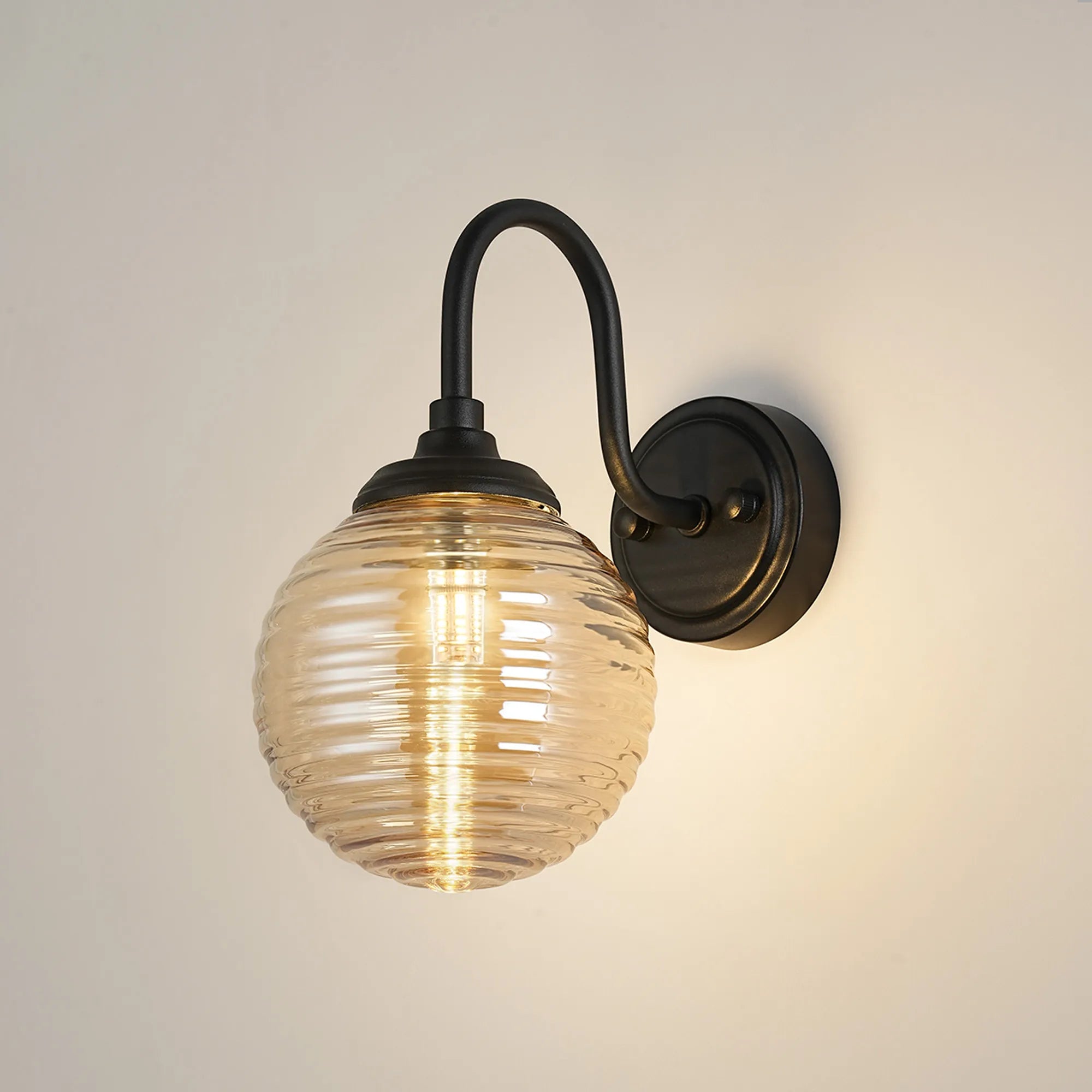 Dene Curved Arm Wall Light - 1 Light - IP44 Satin Black & Amber Ribbed Round Glass