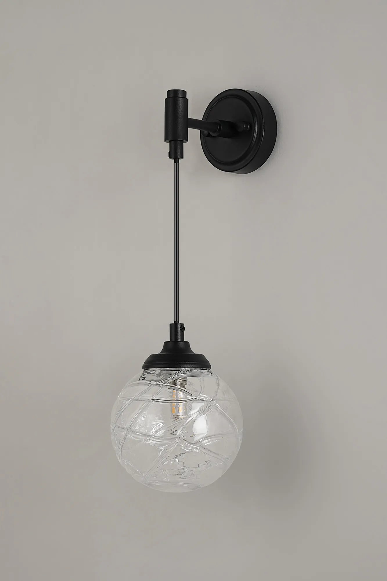 Dene Adjustable Single Wall Light IP44 - Satin Black & Clear Dune Effect Round Glass