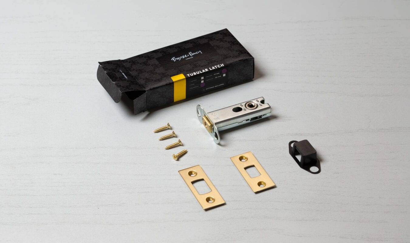 Box contents: tubular latch body, brass faceplates, strike plate, screws and packaging for the 57mm latch.