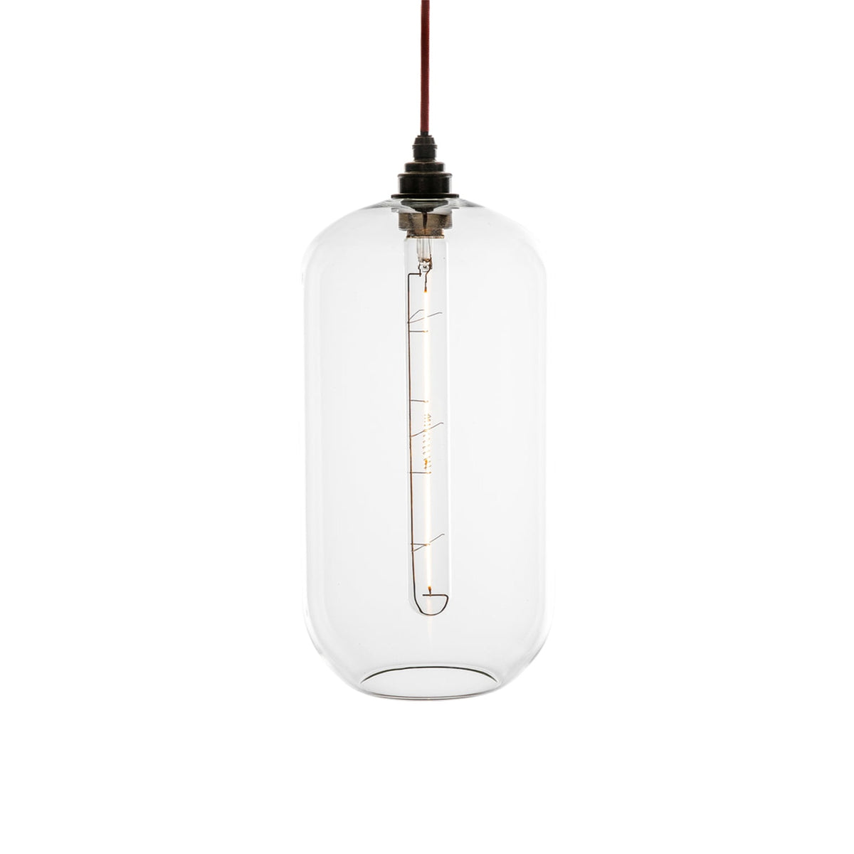 Leverint Charlton pendant in clear hand blown glass with a dark bronze toned fitting and red fabric cable, studio shot on white