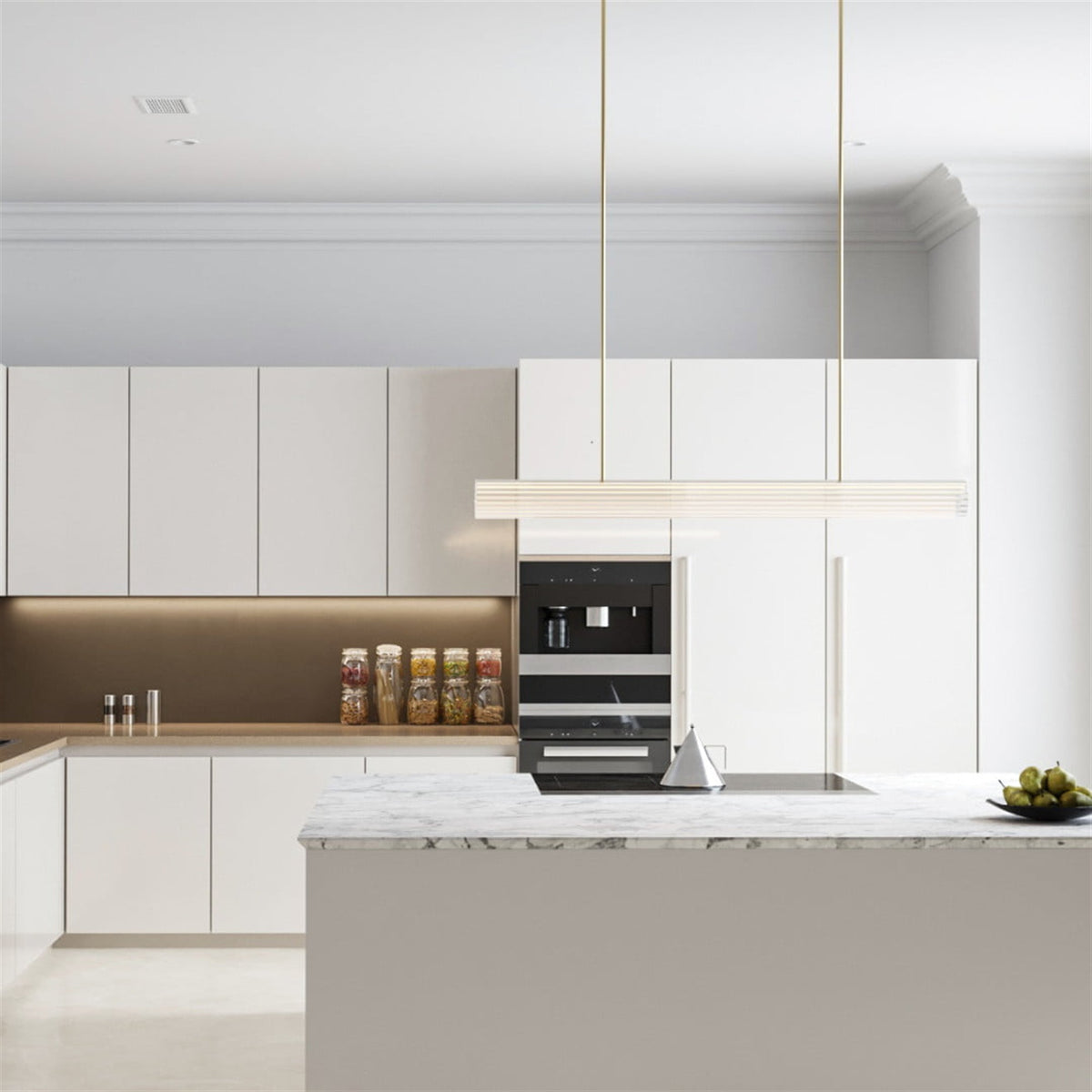 Leverint Temple Rod Pendant, a long ribbed glass bar on two slim brass rods, unlit in a white contemporary kitchen (lifestyle photo, length may differ from the Medium)