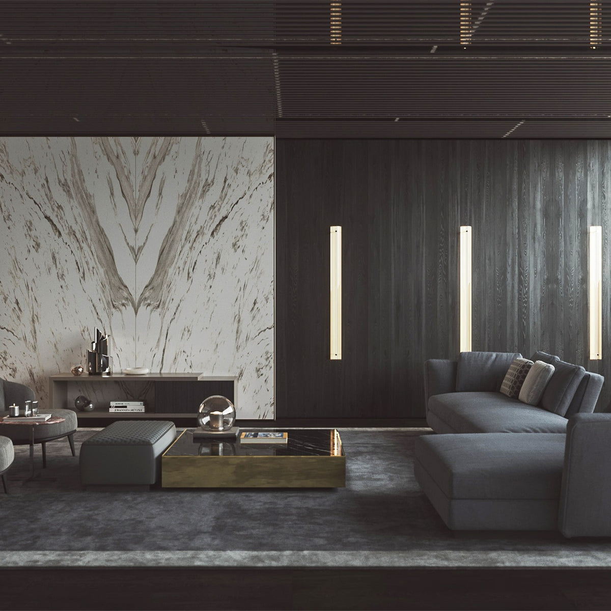 Computer rendered dark living room with three tall lit Leverint Temple Pillar Lights on a charcoal timber wall behind a grey corner sofa