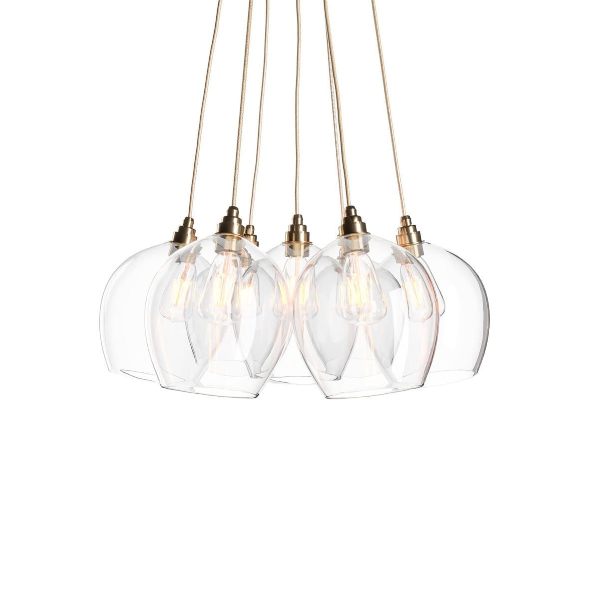 Leverint Wimbledon Bunched Cluster 7 Way with seven clear glass dome pendants bunched together, brass toned lamp holders, gold coloured fabric flex and filament bulbs, studio shot on white