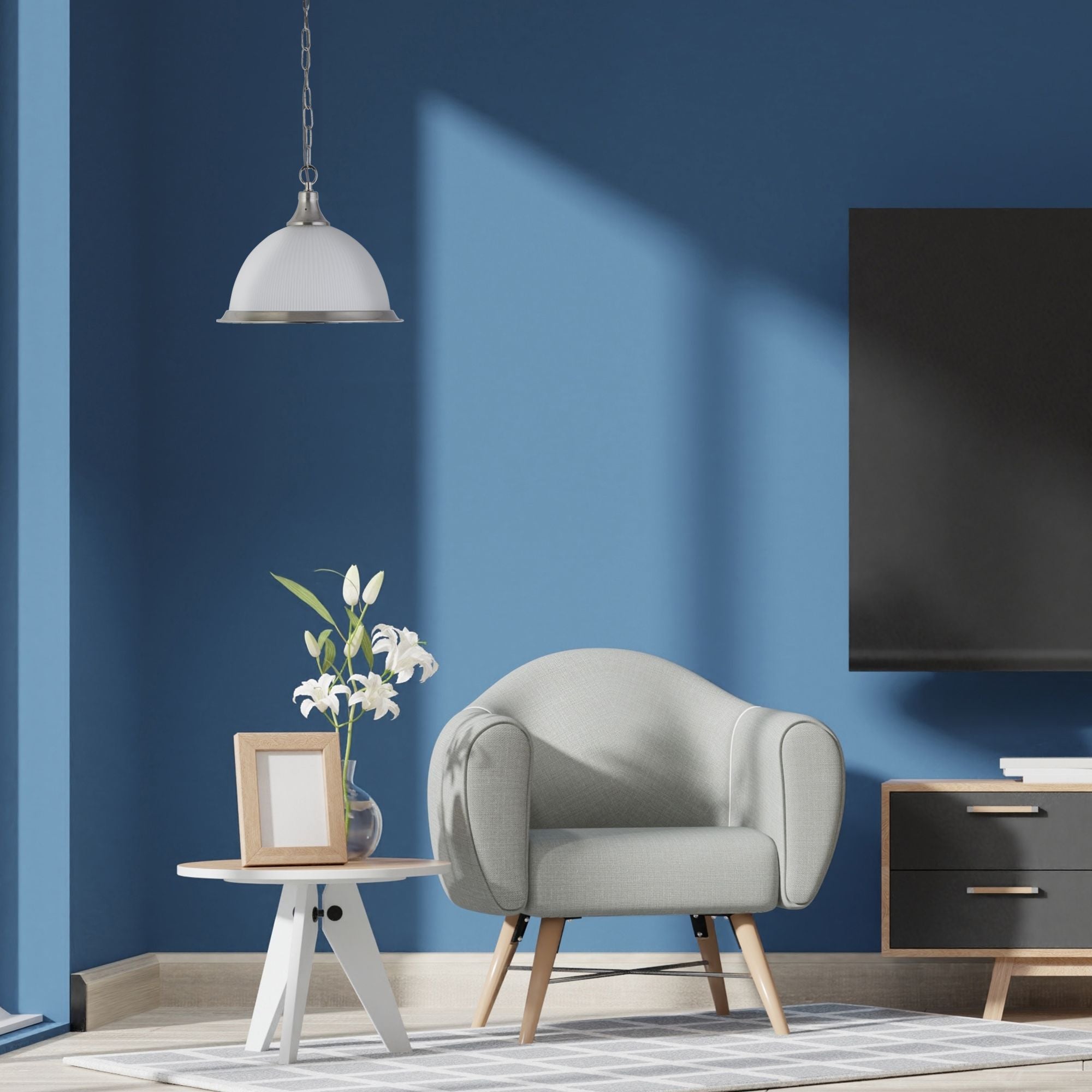 American Diner pendant in satin silver styled above a side table in a blue living room setting
