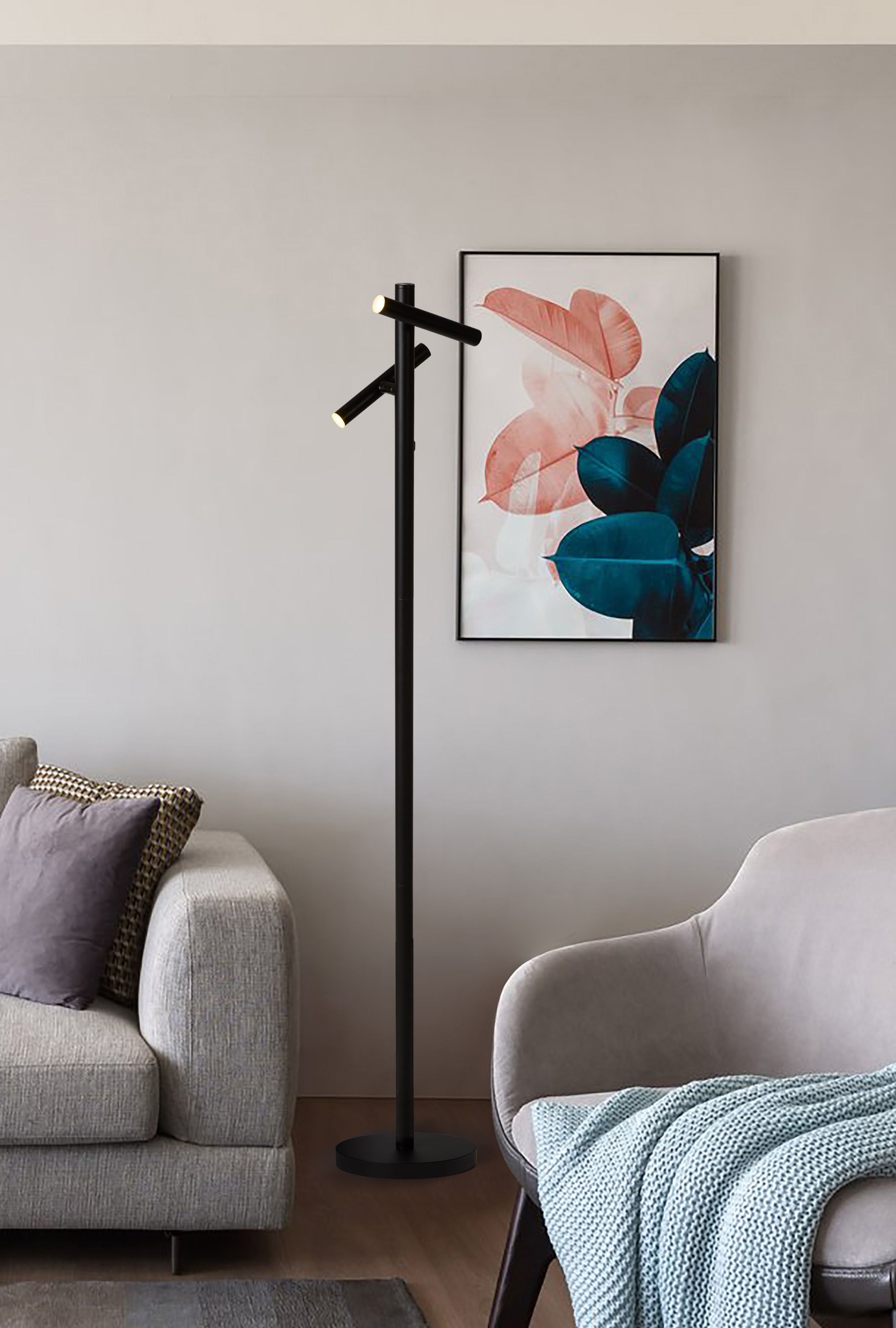 Searchlight Rechargeable 2 Light Floor Lamp switched on beside a sofa and framed print in a living room
