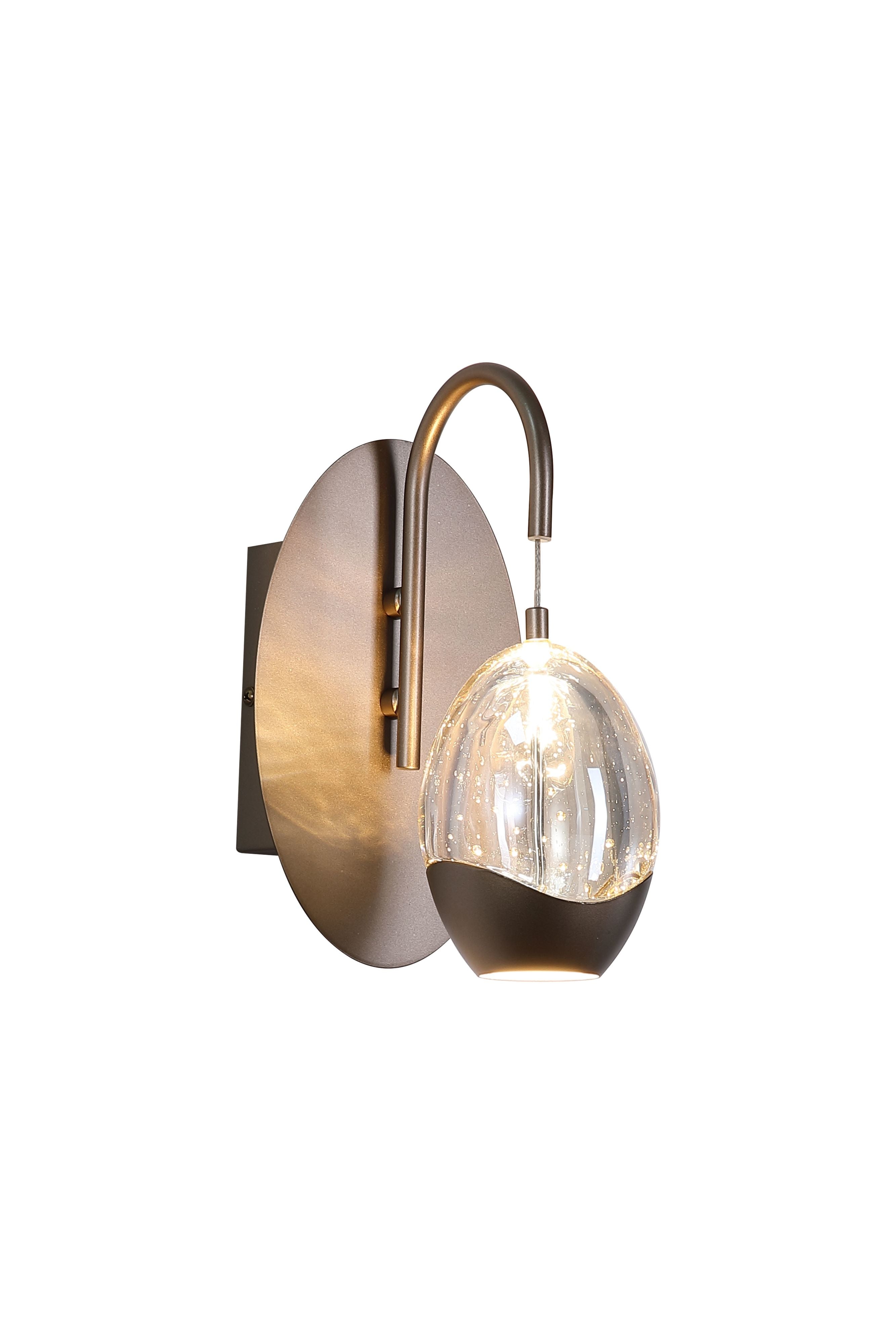 Searchlight Seeds 1 Light Wall Light in bronze, curved arm and teardrop bubble glass shade lit against a white background