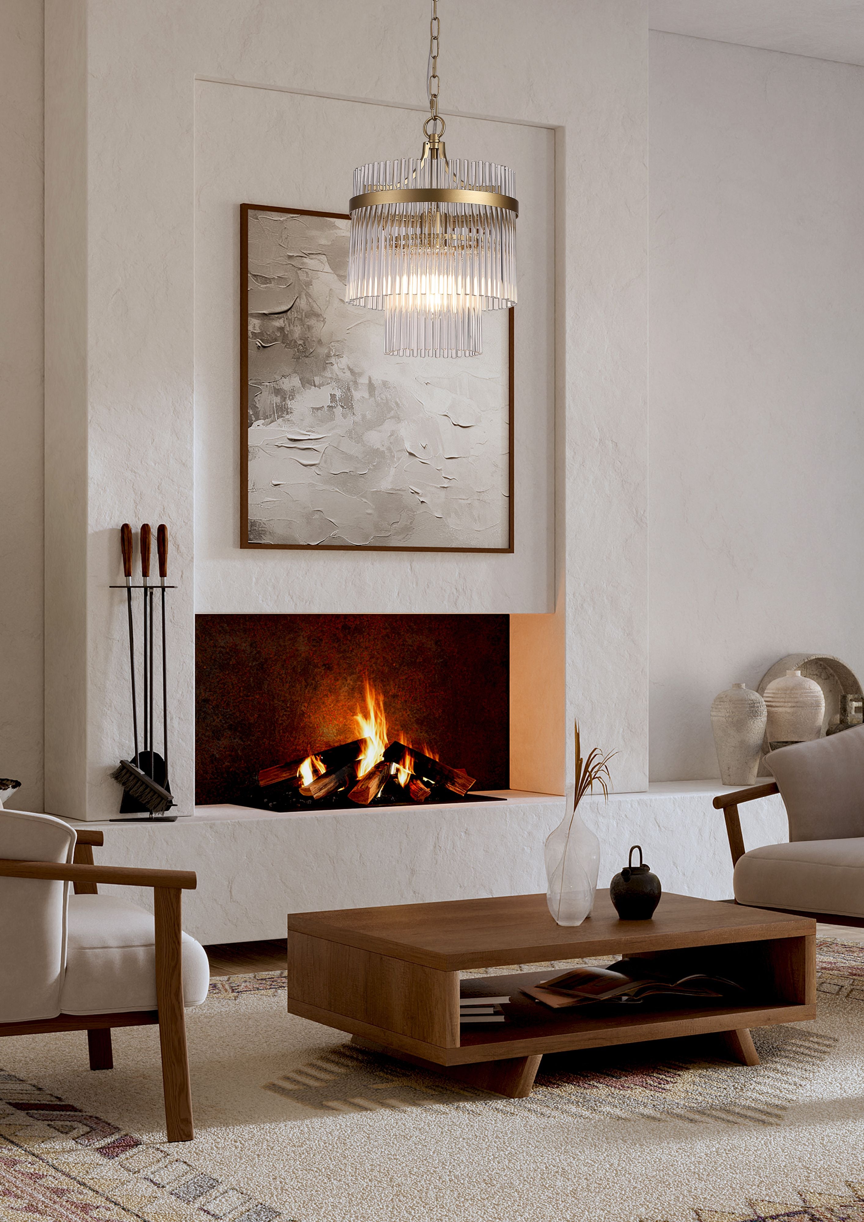 Searchlight Lara 1 light pendant in gold and clear glass hanging above a painted fireplace between two armchairs in a styled living room