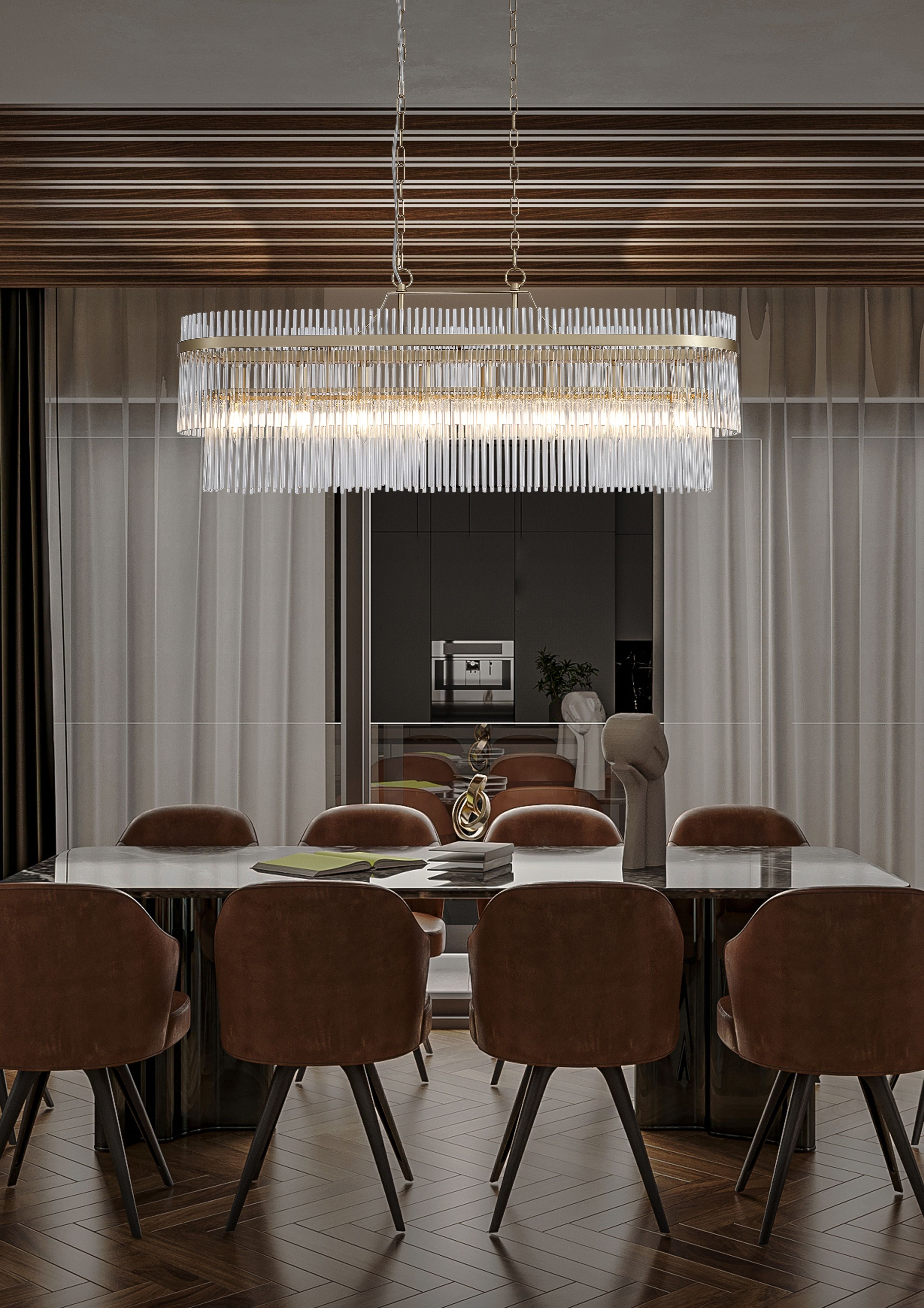 Searchlight Lara 8 light oval pendant in gold and clear glass hanging above a dining table in a dark wood panelled dining room