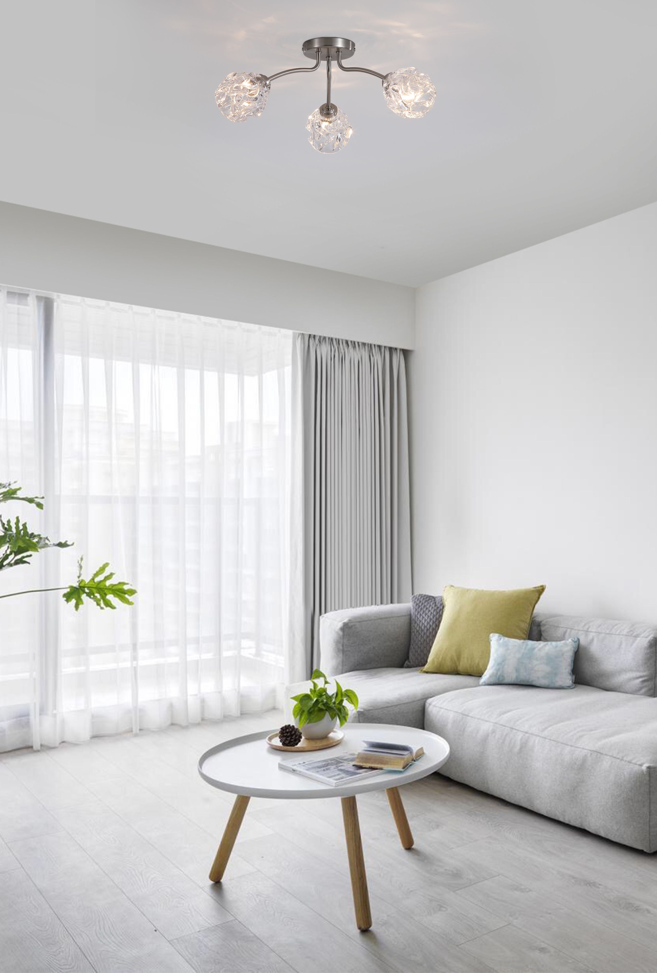 Searchlight Astral 3 light flush ceiling light in satin nickel styled above a round coffee table in a grey toned living room