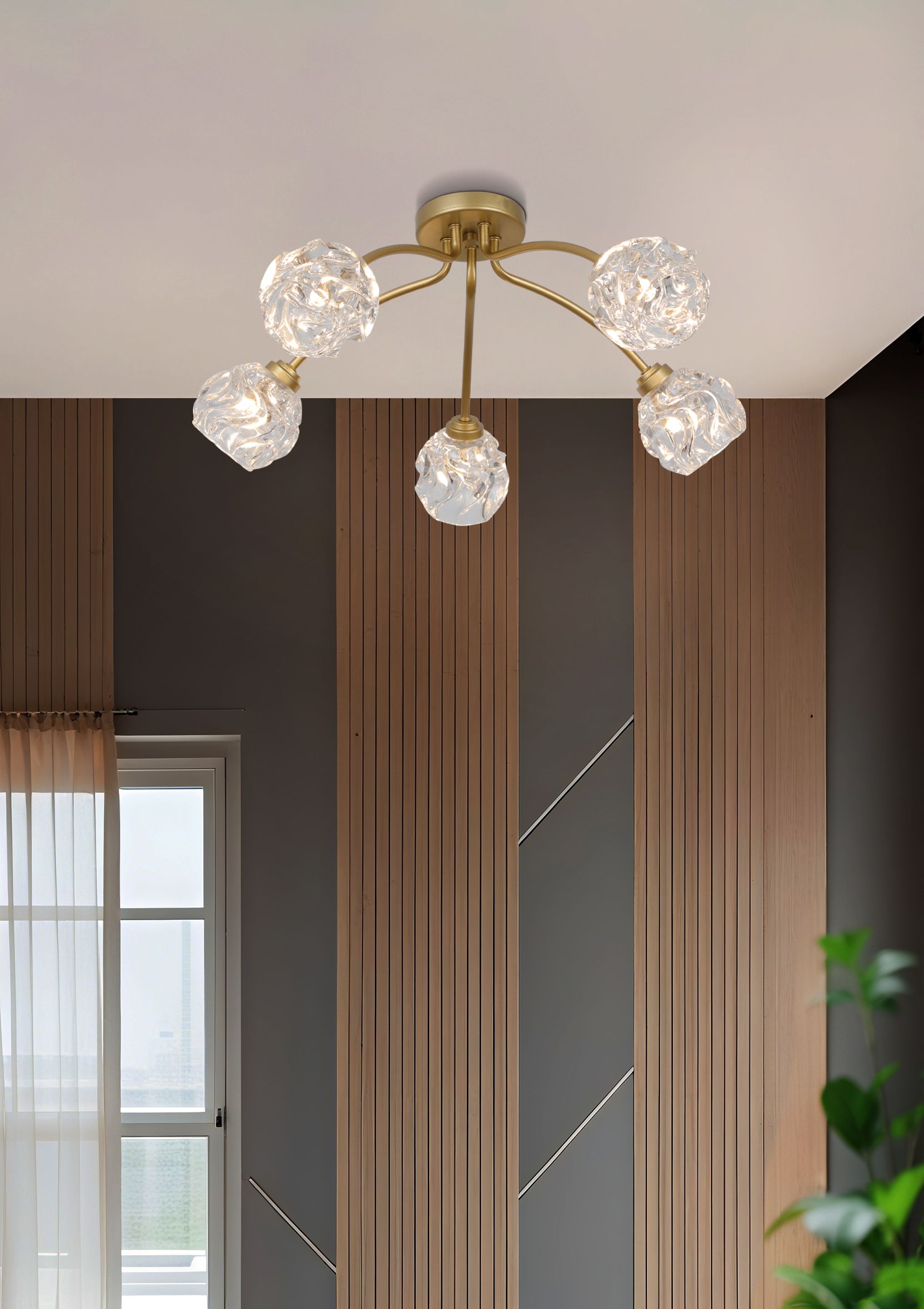 Searchlight Astral 5 Light Flush in gold styled above a window in a living room with a wood slat feature wall