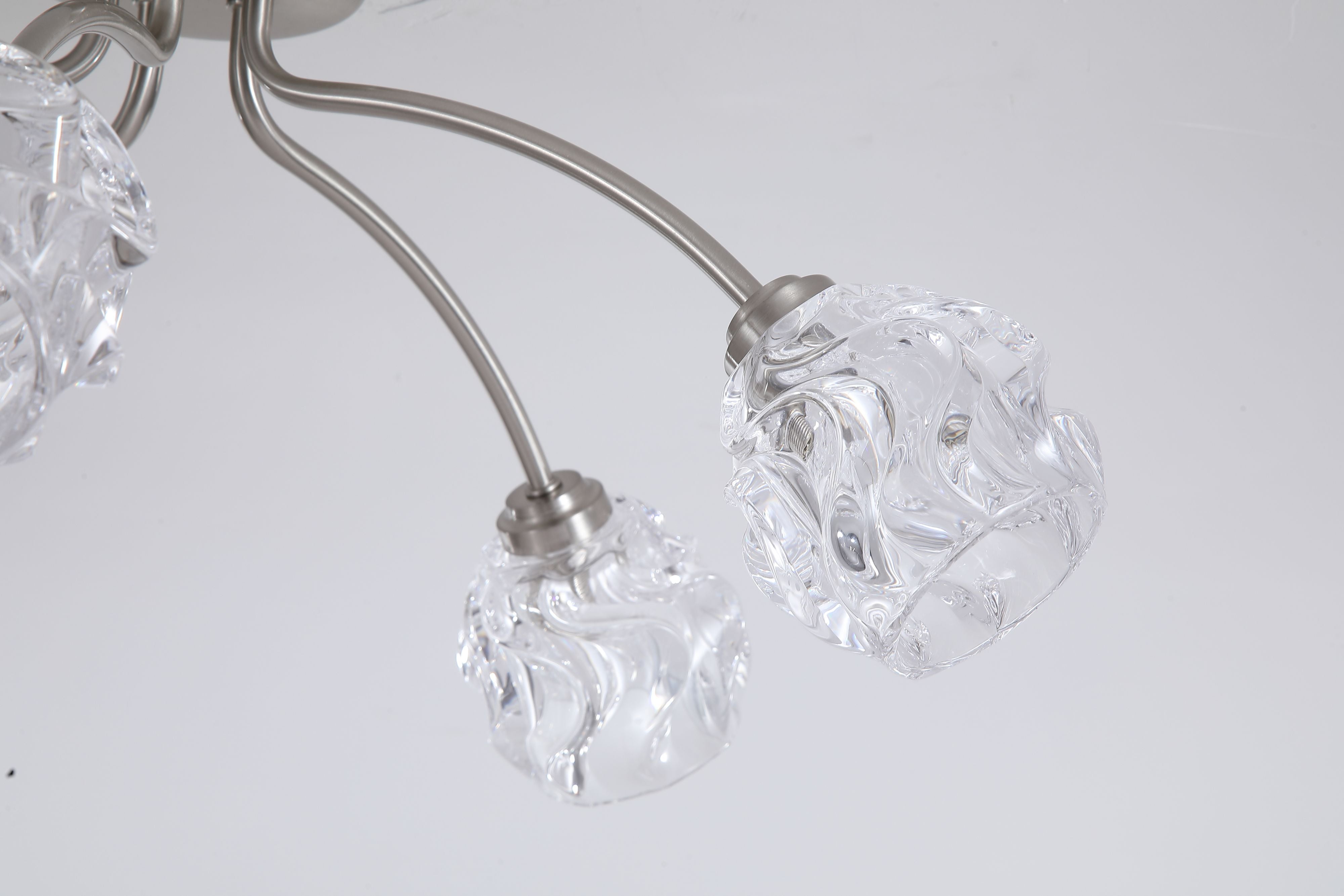 Close up of the Searchlight Astral 5 Light Flush in satin nickel showing the ceiling plate and the crumpled texture of the glass shades
