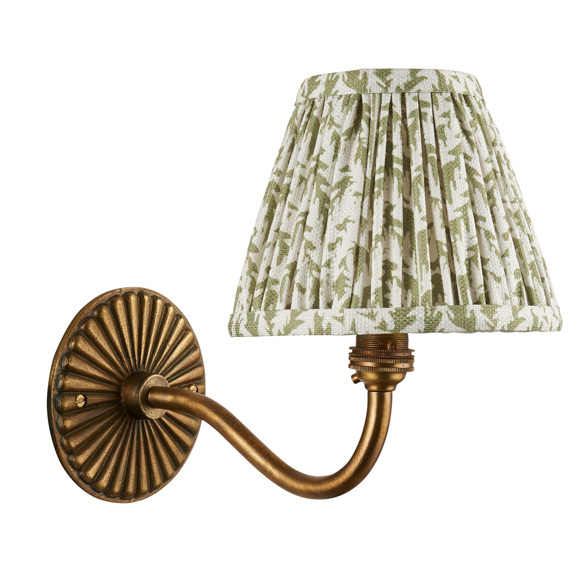 Endon Dahlia Curve antique brass wall light unlit, cut out on white, fluted backplate and green leaf print pleated shade