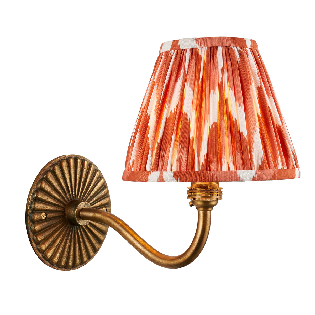 Endon Dahlia Curve wall light in antique brass with apricot orange zigzag shade, unlit, cut out on a white background