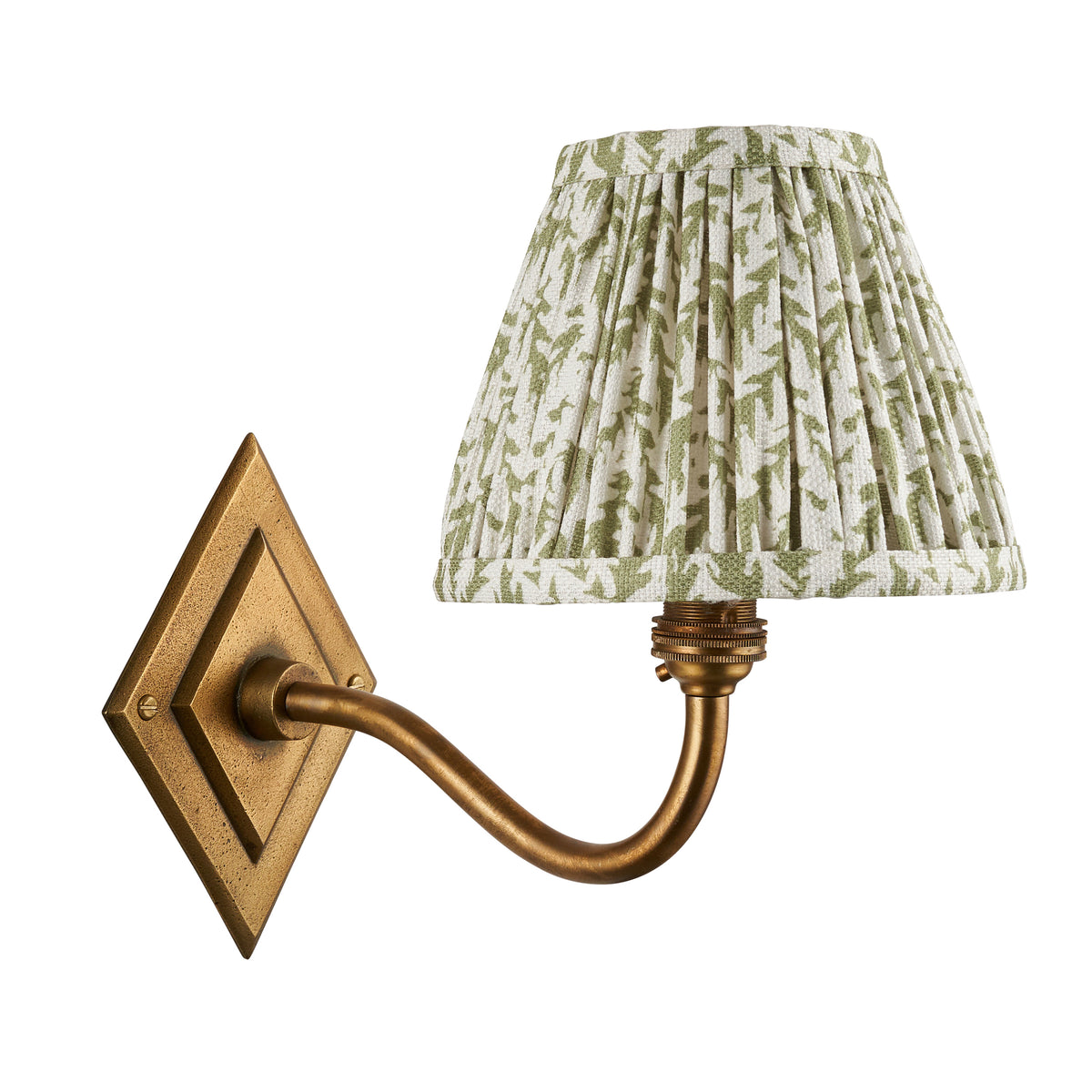Unlit Endon Diamond Curve wall light in antique brass with the 16cm green leaf print pleated shade, cut out on a white background