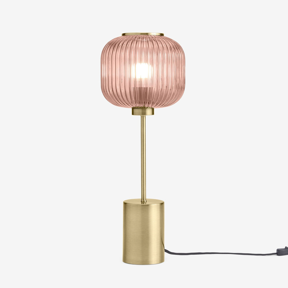 MADE Briz large table lamp in antique brass with ribbed pink glass shade, studio shot with black cable