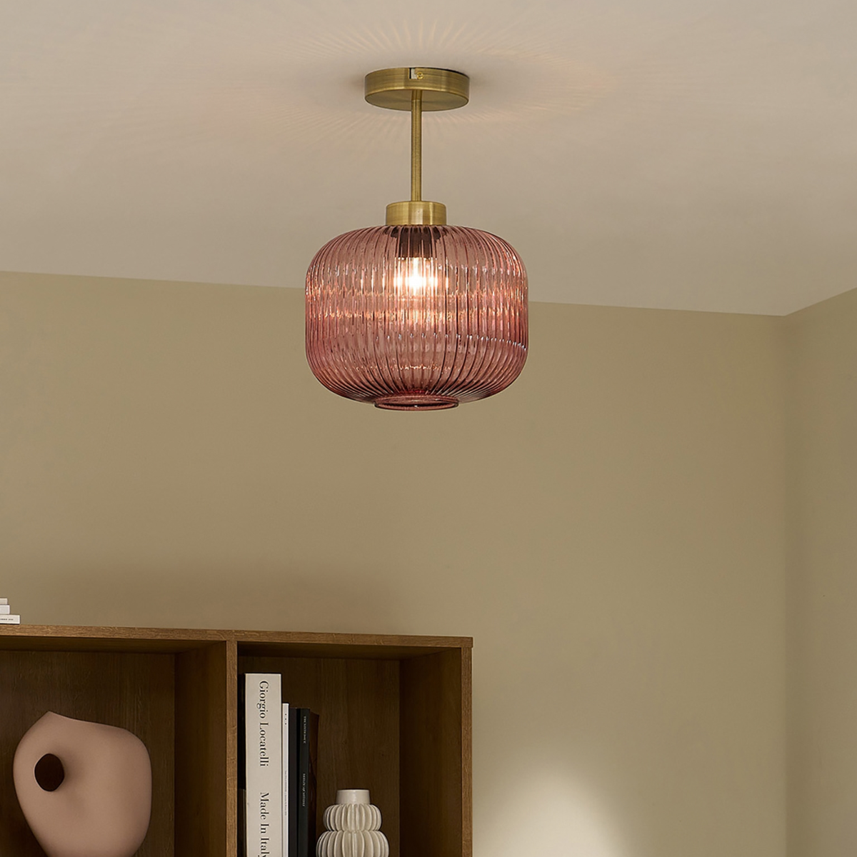 MADE.COM Briz flush ceiling light in antique brass with ribbed pink glass shade, lifestyle shot in a room