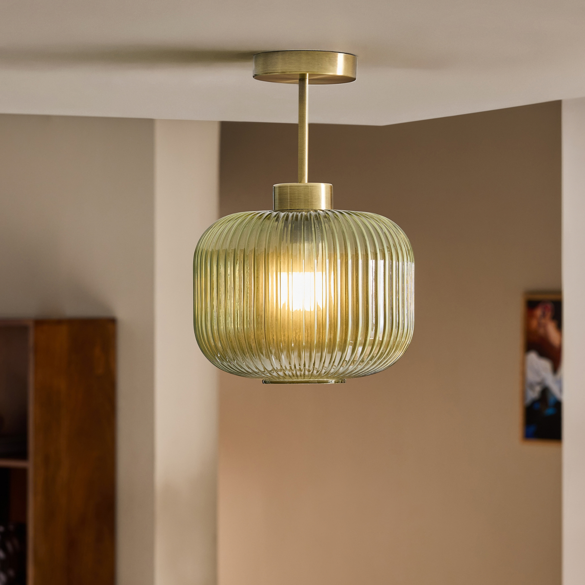 MADE.COM Briz flush ceiling light in antique brass with ribbed green glass shade, lifestyle shot in a room