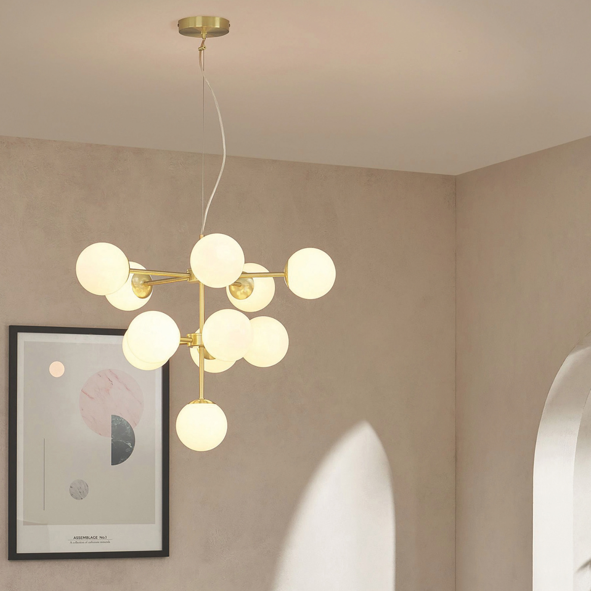 MADE.COM Globe chandelier in brushed brass with opal glass globes in a blush toned room