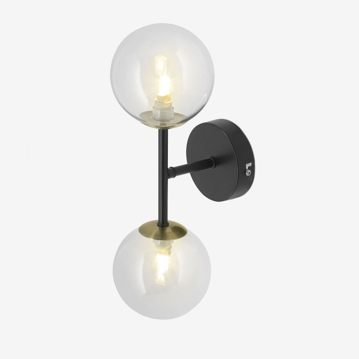 MADE Globe wall light in matt black and antique brass with two clear glass globes, studio side view