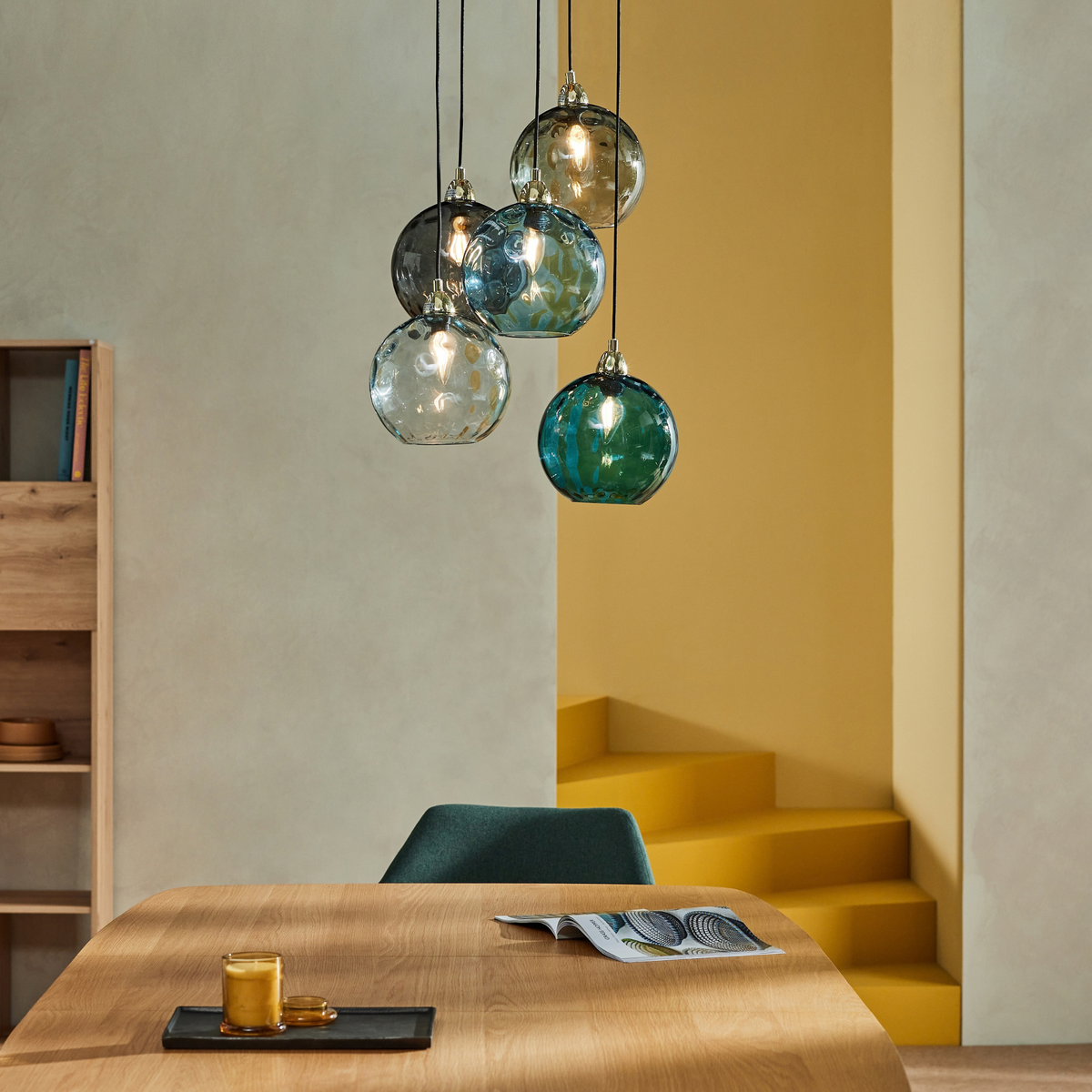 MADE.COM Ilaria 5 light cluster pendant with blue and grey dimpled glass shades above a wooden table