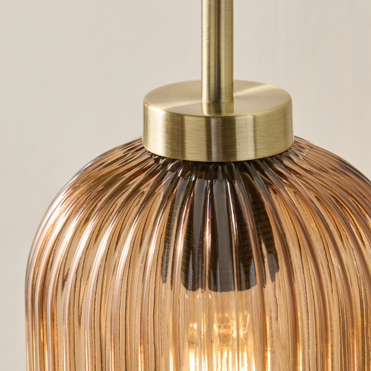 MADE.COM Briz Wall Light in Antique Brass with Ribbed Amber Glass Shade