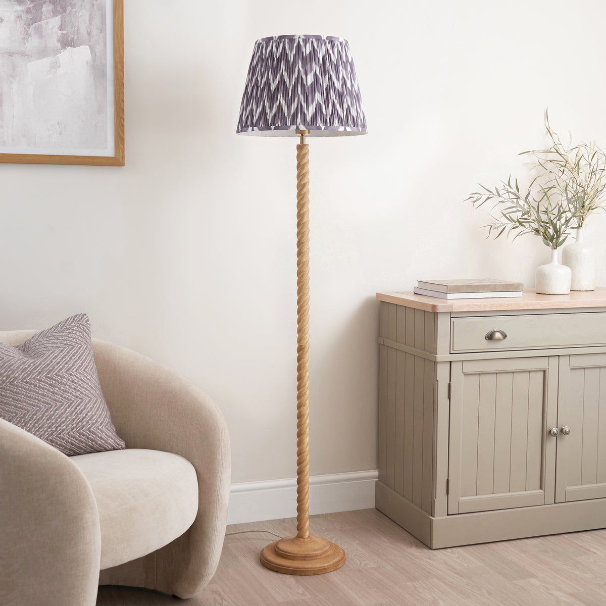 Endon Twist floor lamp unlit in a neutral living room with pearl grey zigzag shade, cream armchair and grey painted sideboard