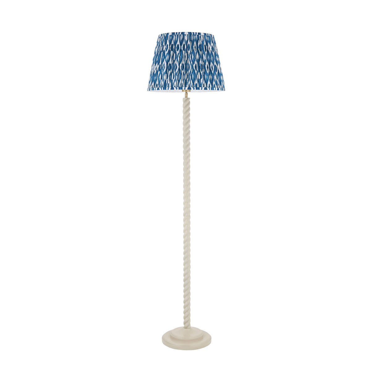 Full view of the unlit Endon Twist floor lamp, satin almond white twisted stem with a blue ikat shade on a plain white background