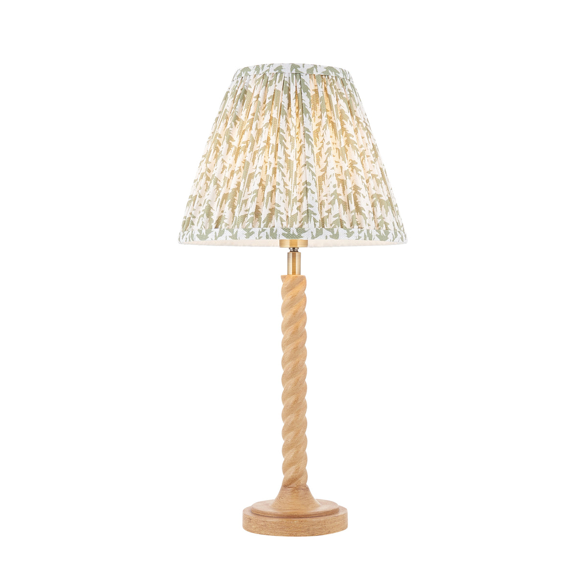 Endon Twist table lamp lit and cut out on white, oak effect twisted stem base with a glowing herb garden green leaf print pleated shade