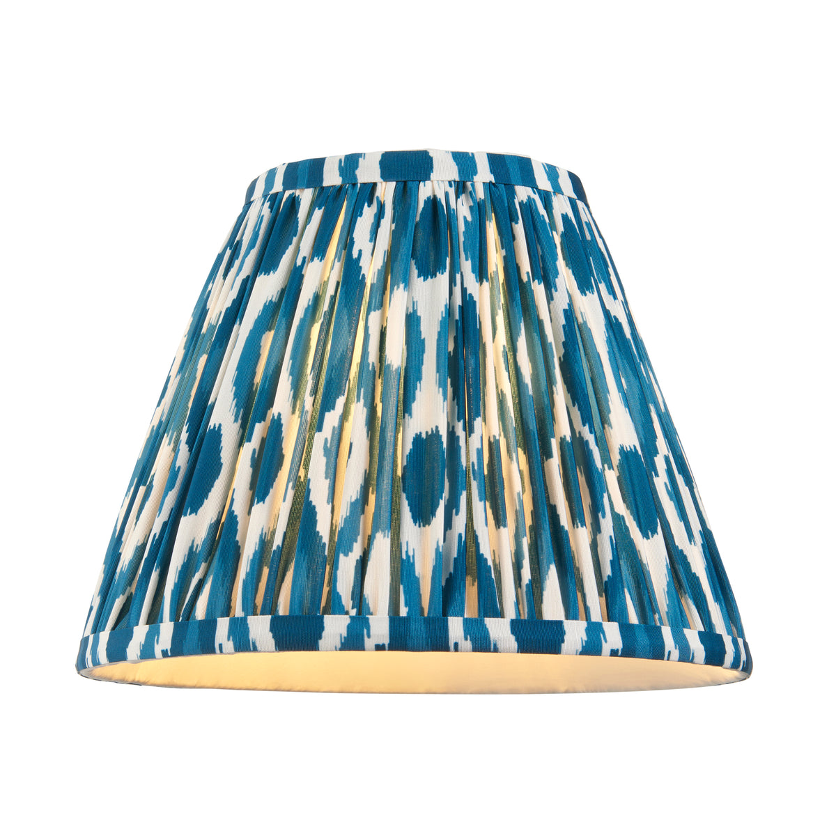 Endon 25cm Ikat lamp shade in marlin blue and white pleated faux silk, lit from inside, on a white background