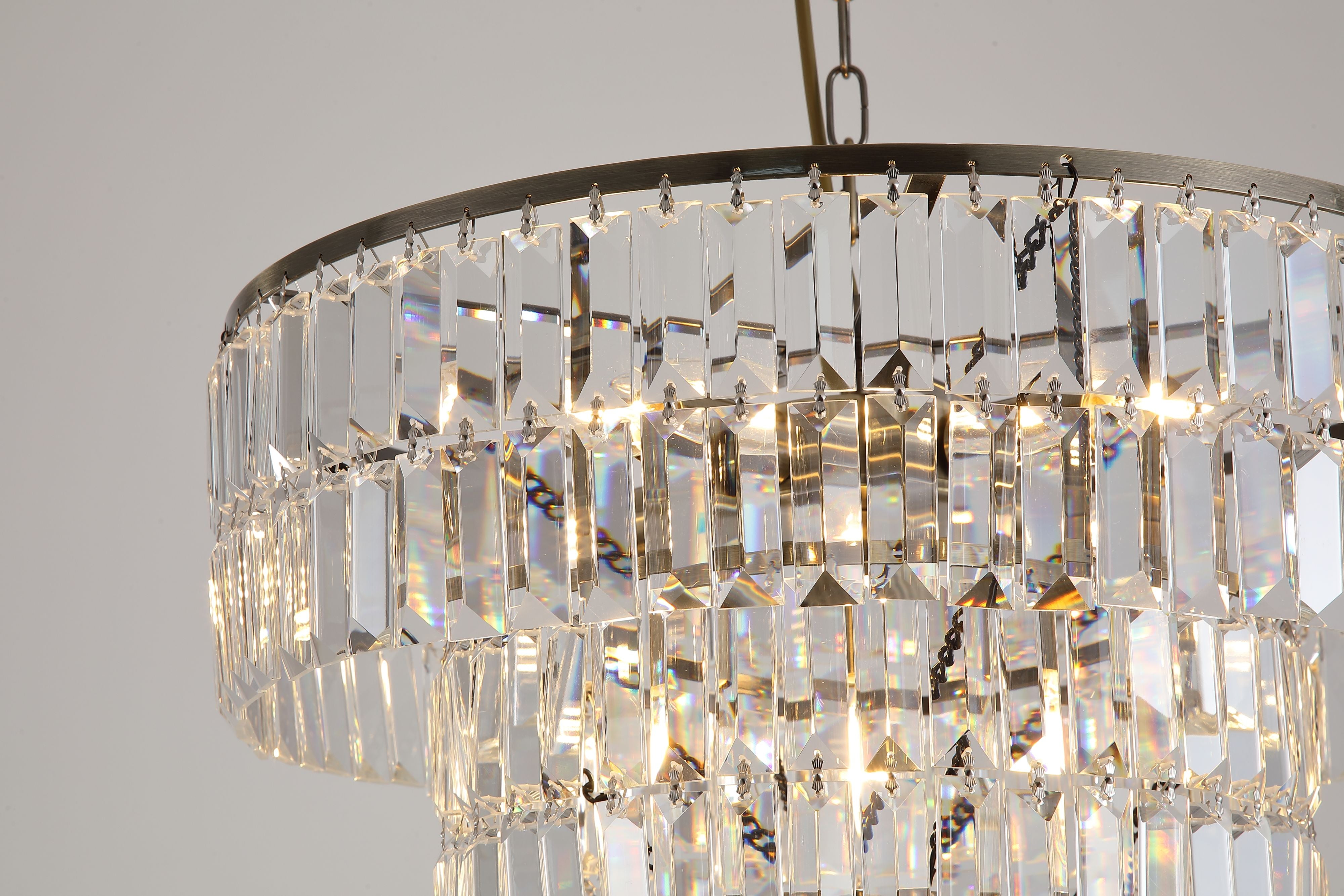 Close up of the lit crystal tiers and chain on the Empire 5 Light Pendant