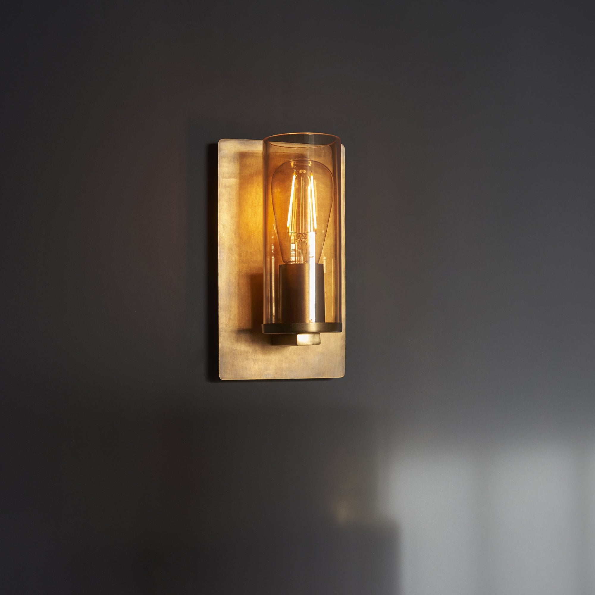Utopia Swirl Wall Light - Brass Patina With Champagne Tinted Glass
