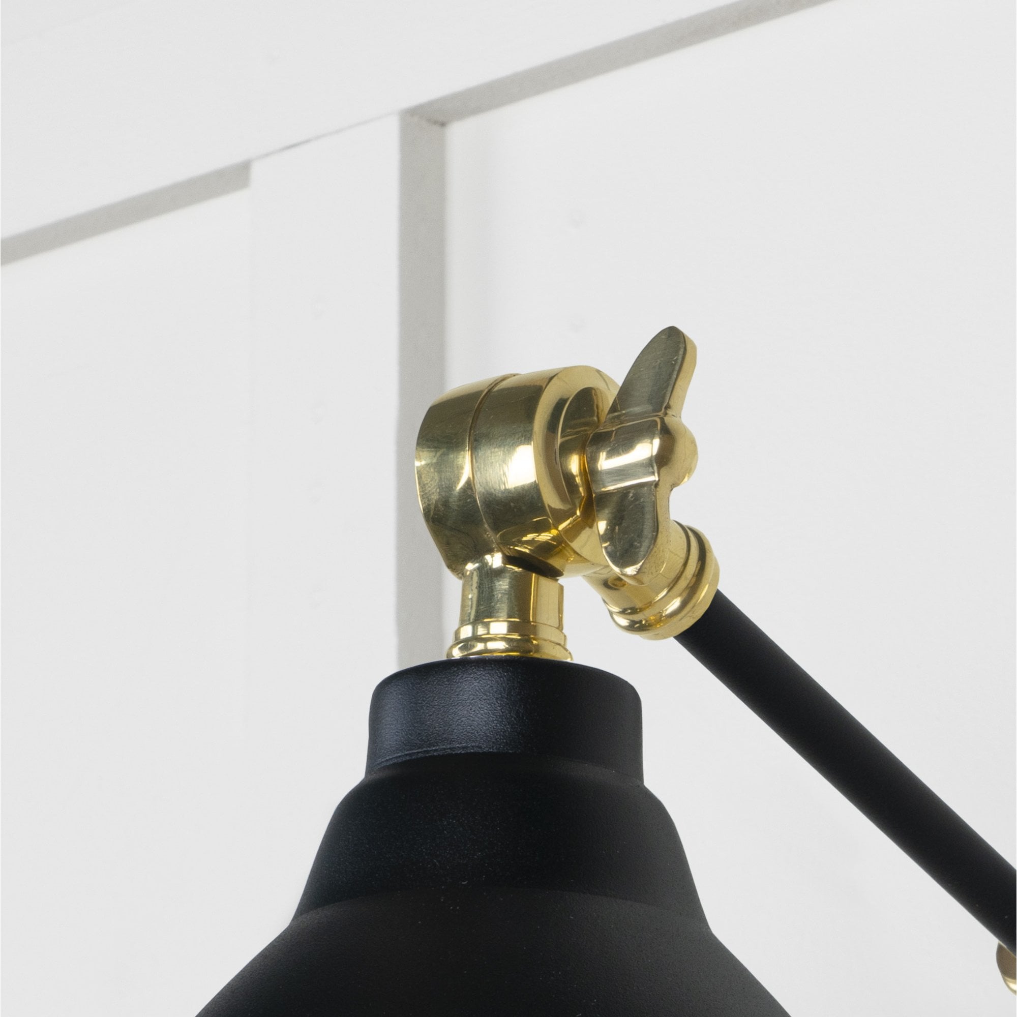 From The Anvil Smooth Brass Brindley Wall Light - Elan Black