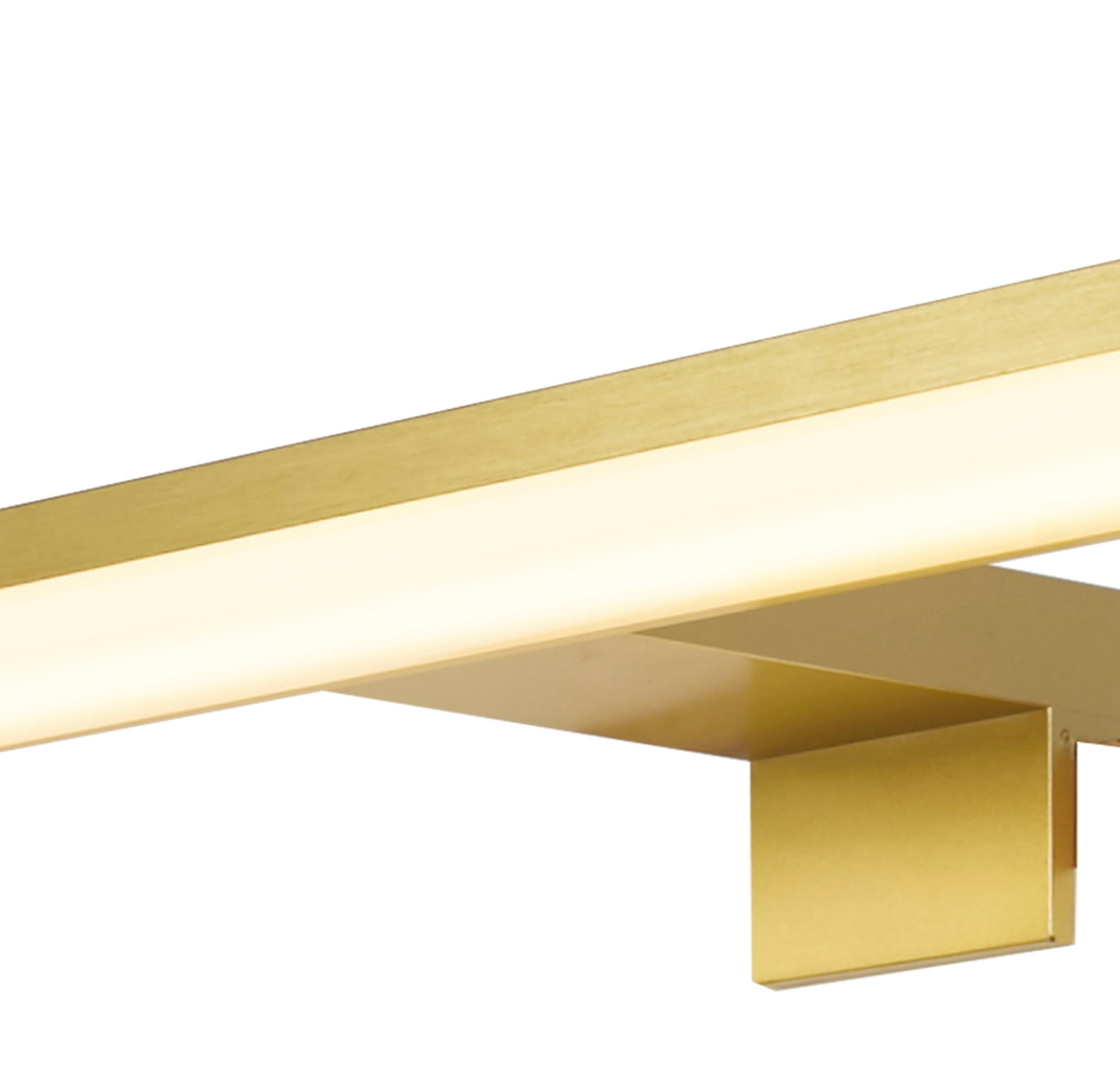 Close up of the Kos mirror light's central wall mounting bracket in gold finish, showing the fixing screws and the illuminated acrylic diffuser