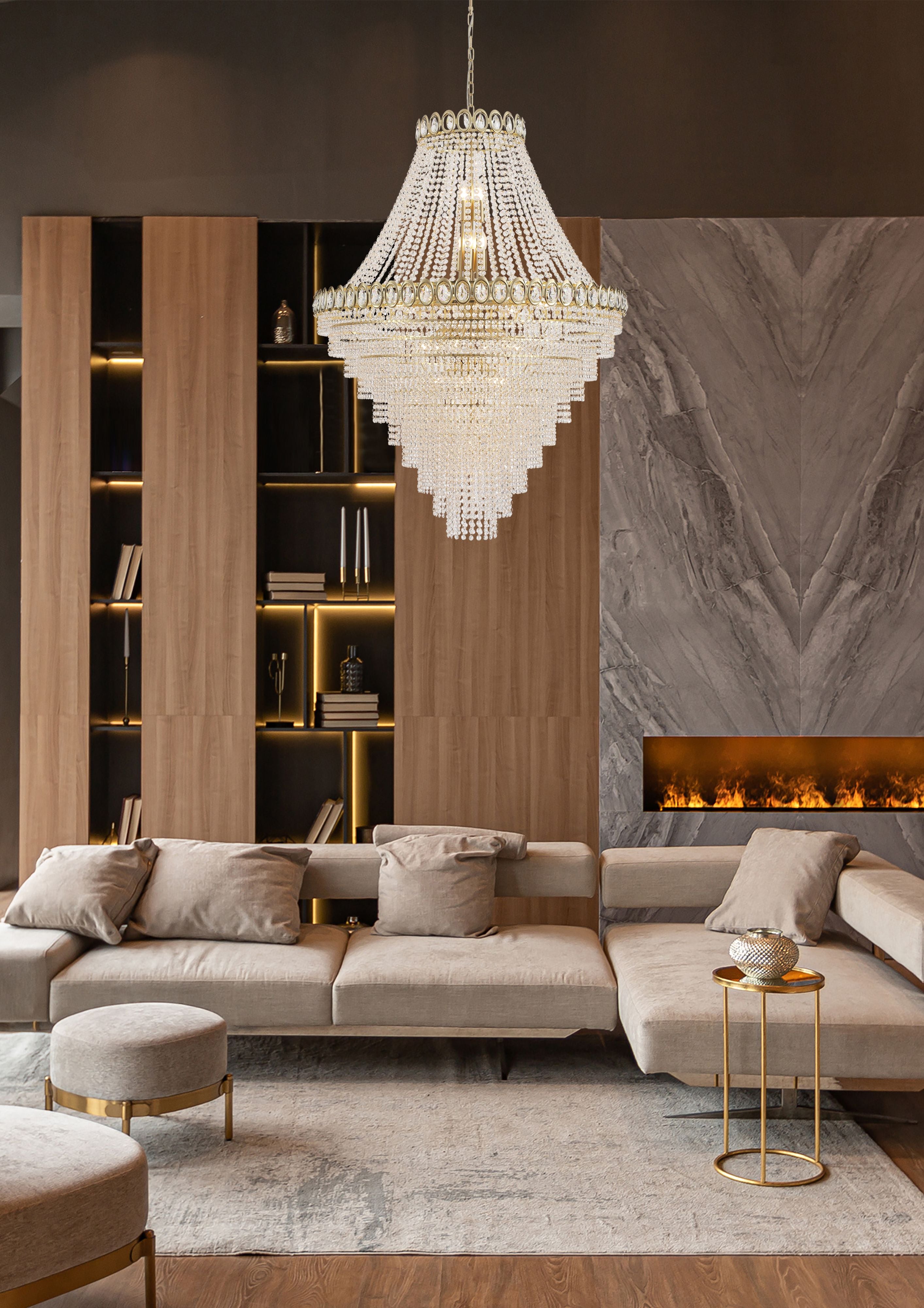 Searchlight Louis Phillipe 28 Light Chandelier styled above a grey sectional sofa beside a lit linear fireplace and wood shelving