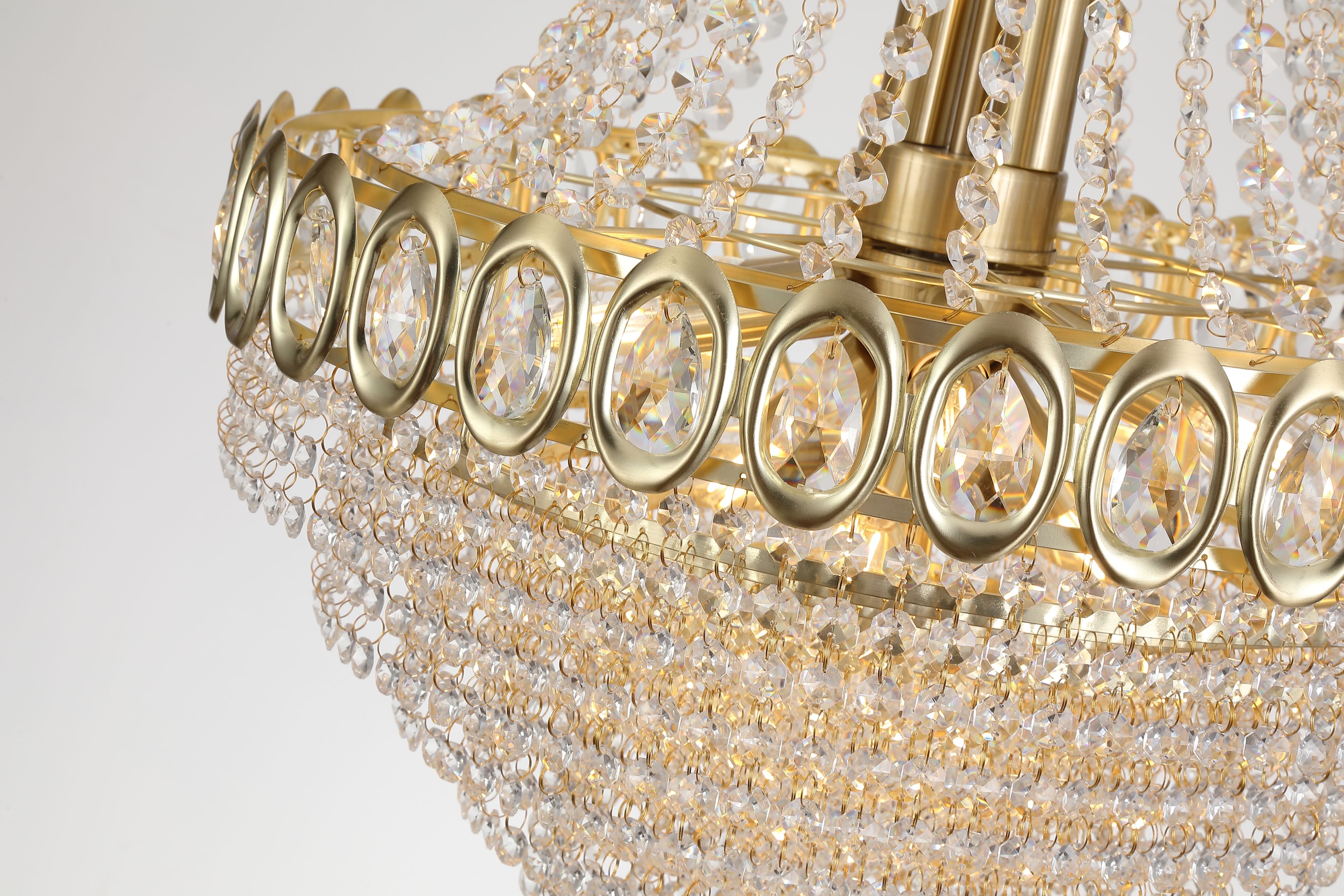 Close up of the oval faceted crystal jewels set into the satin brass band on the Louis Phillipe 11 Light Pendant