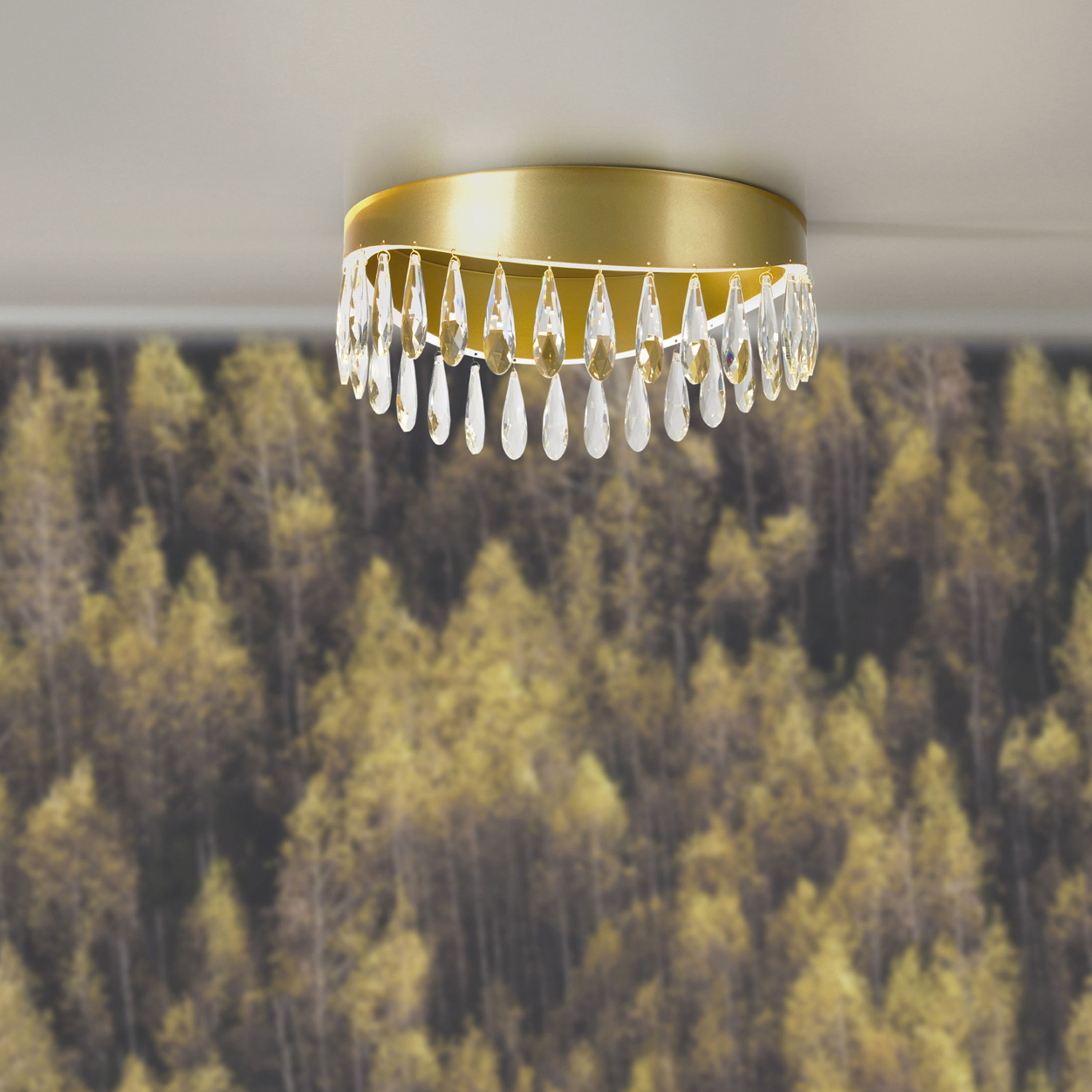 Jewel flush ceiling light in gold mounted on a ceiling above a dark botanical print wallpaper