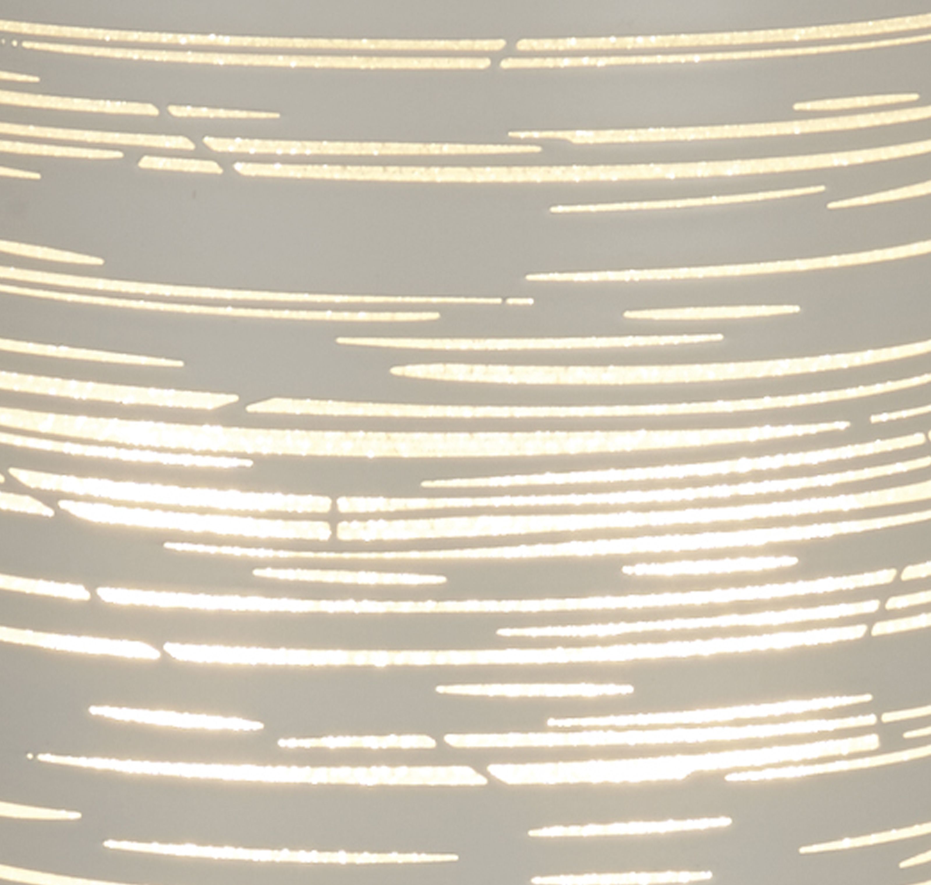 Close up of the Savvy table lamp's scratched, etched texture with light glowing through the fine lines