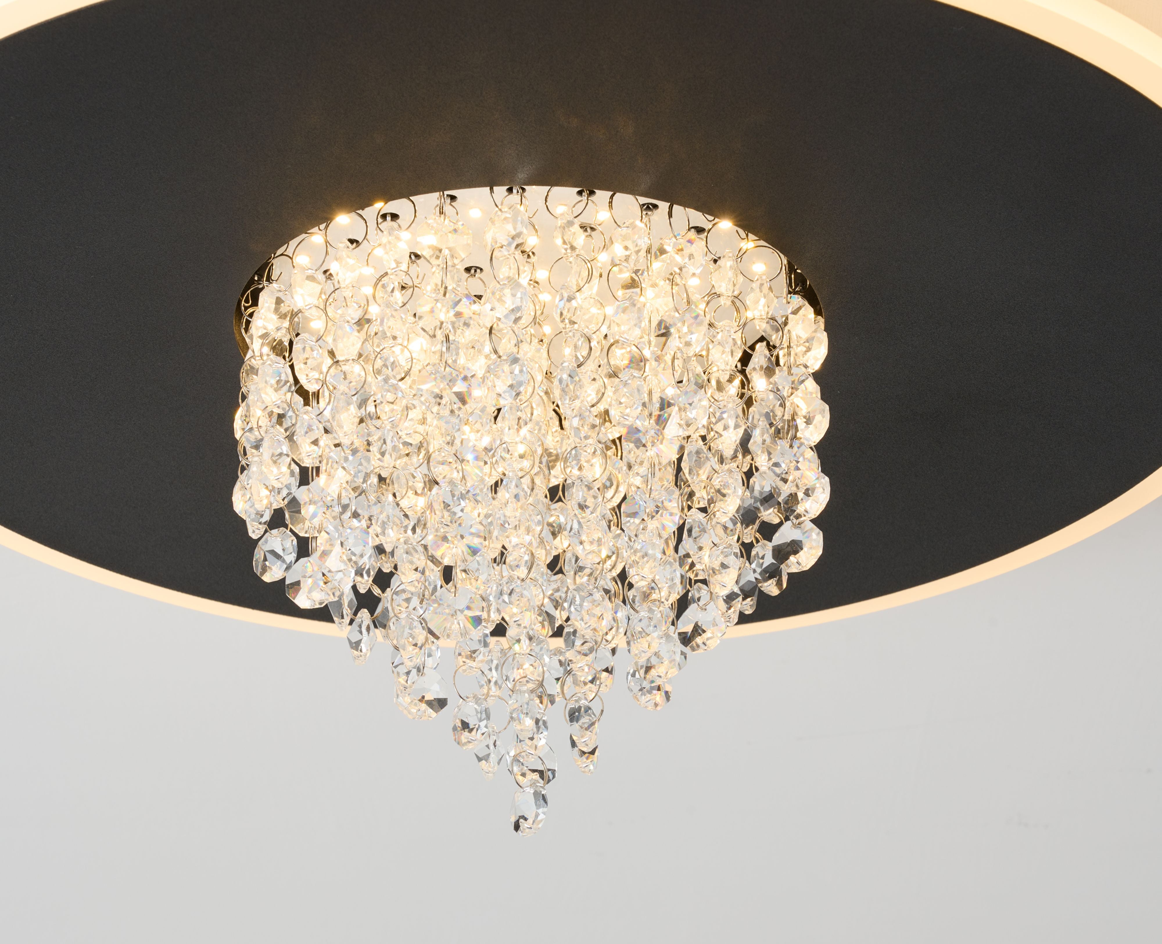 Close up looking up at the illuminated crystal cascade on the Searchlight Deluge LED flush ceiling light in black