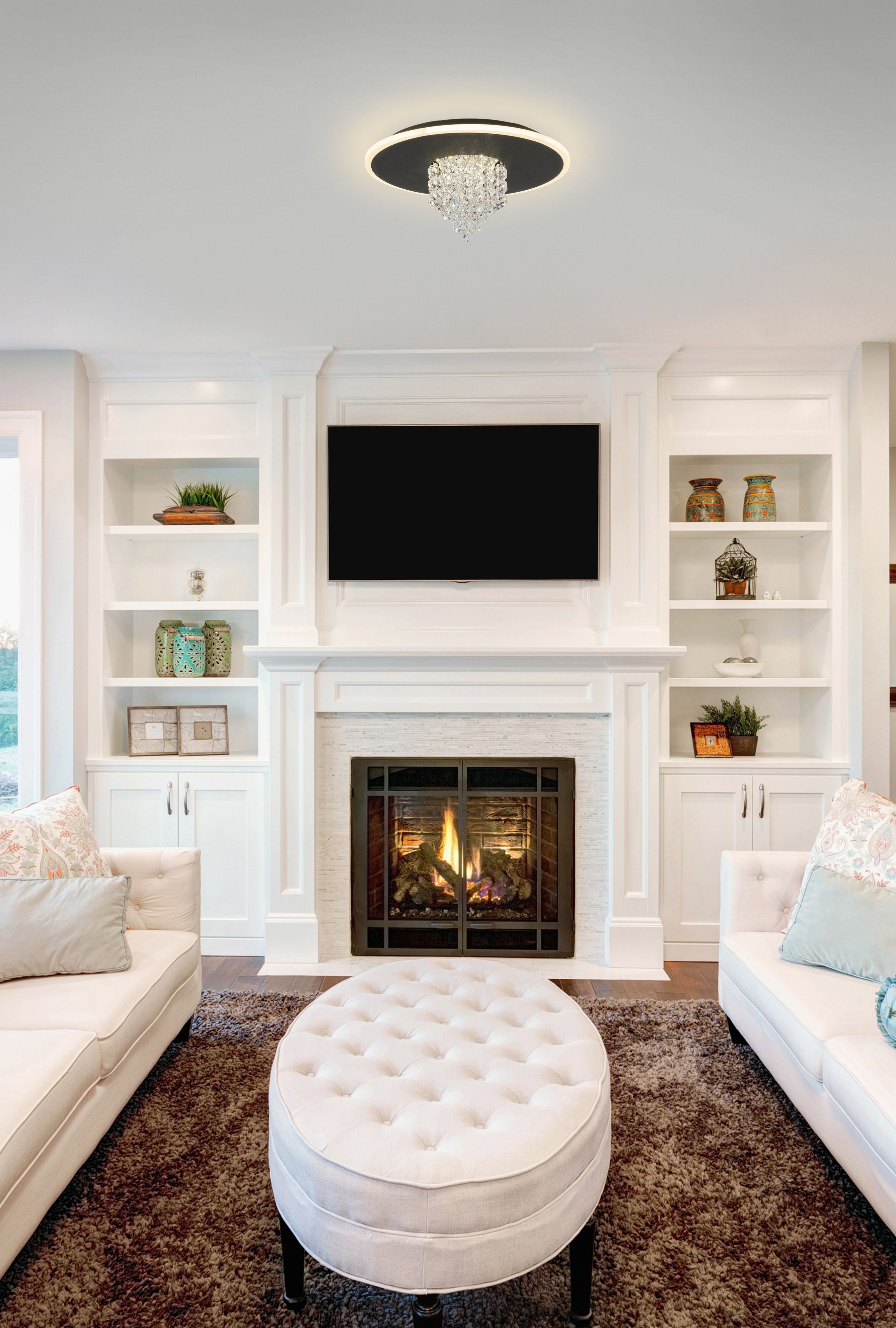 Searchlight Deluge LED flush ceiling light in black installed above a fireplace in a cream toned living room with two sofas