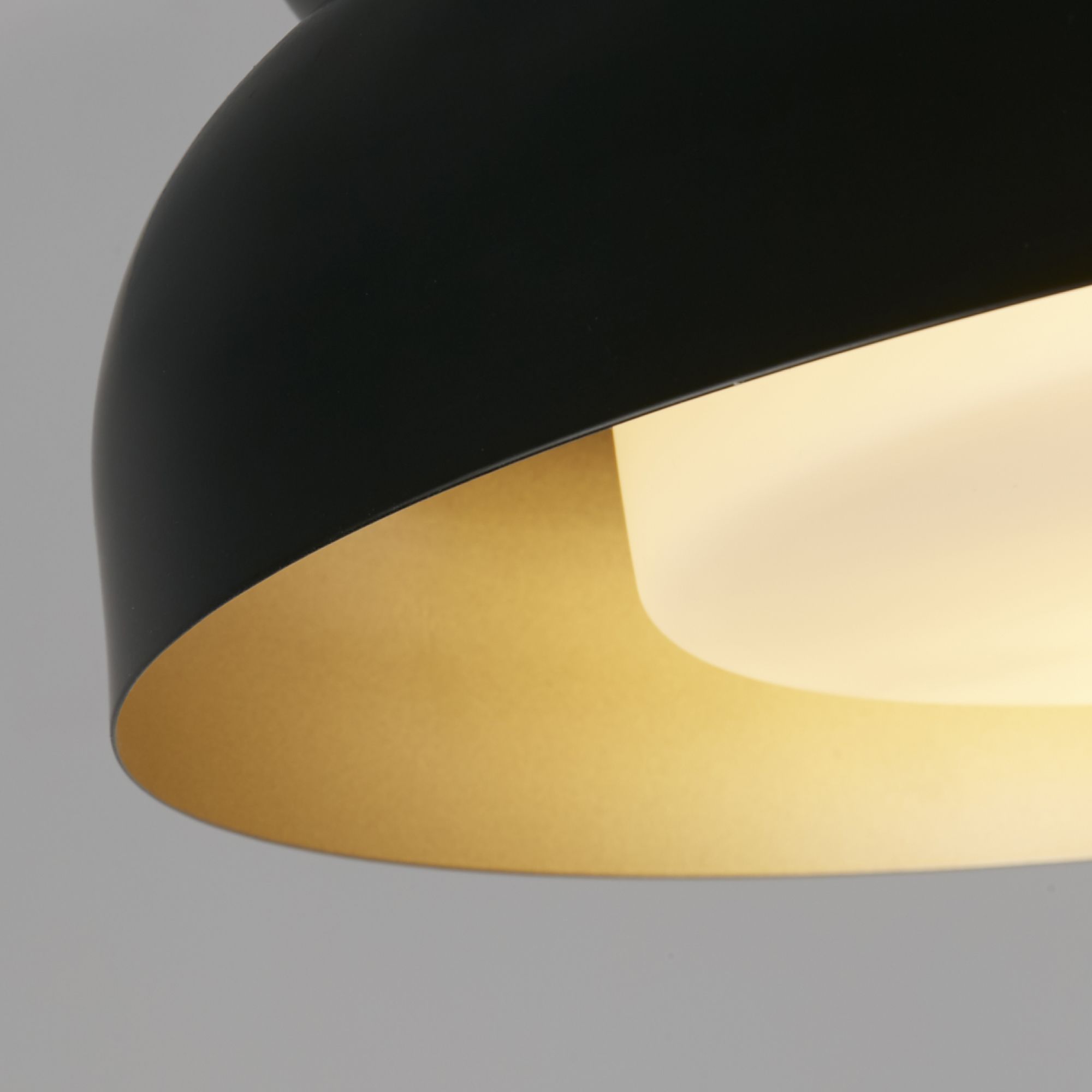 Close up of the black exterior and gold interior on the Searchlight Kendal 2 light flush ceiling light