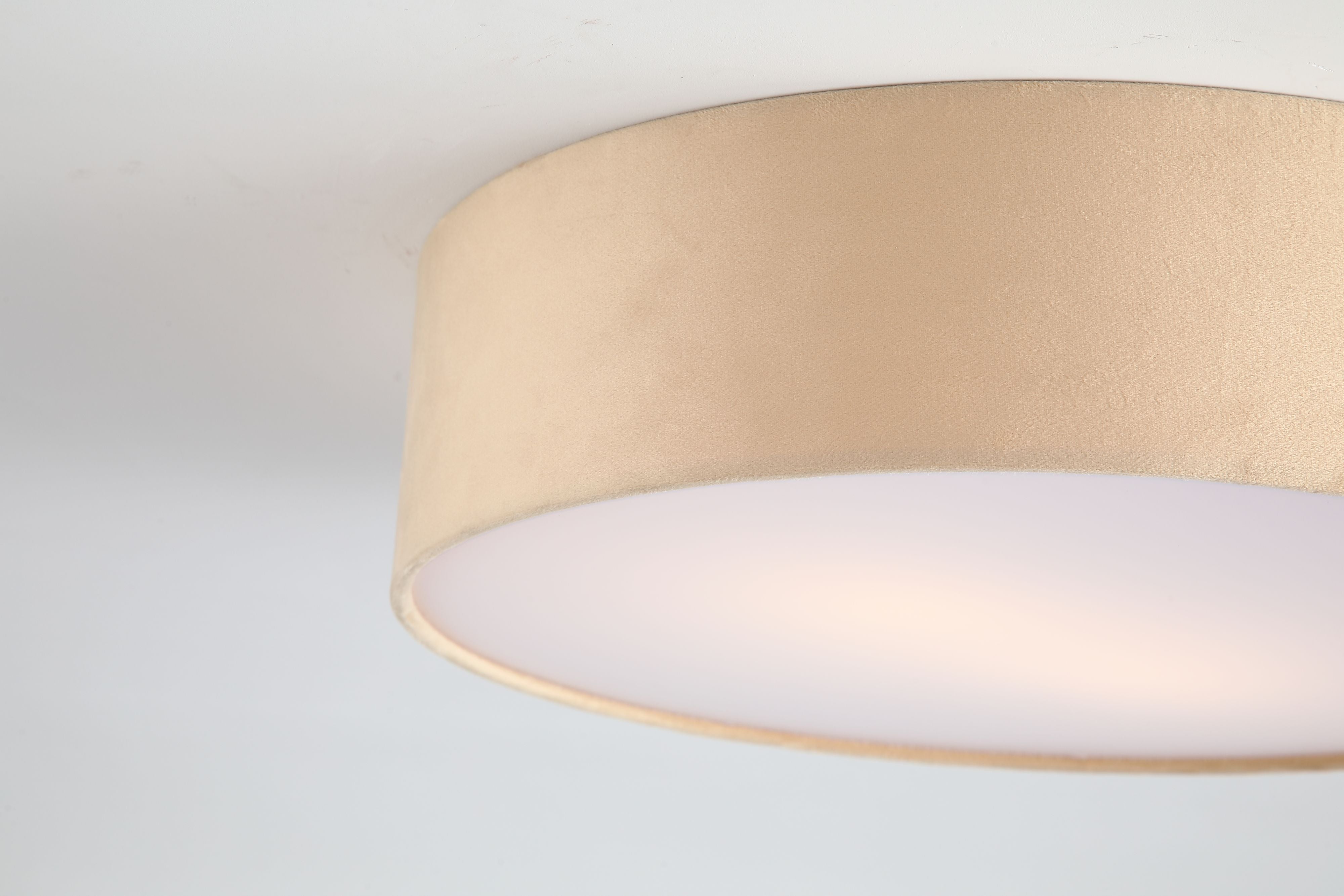Close up of the champagne velvet fabric and frosted diffuser edge on the Searchlight Drum 2 light flush ceiling light