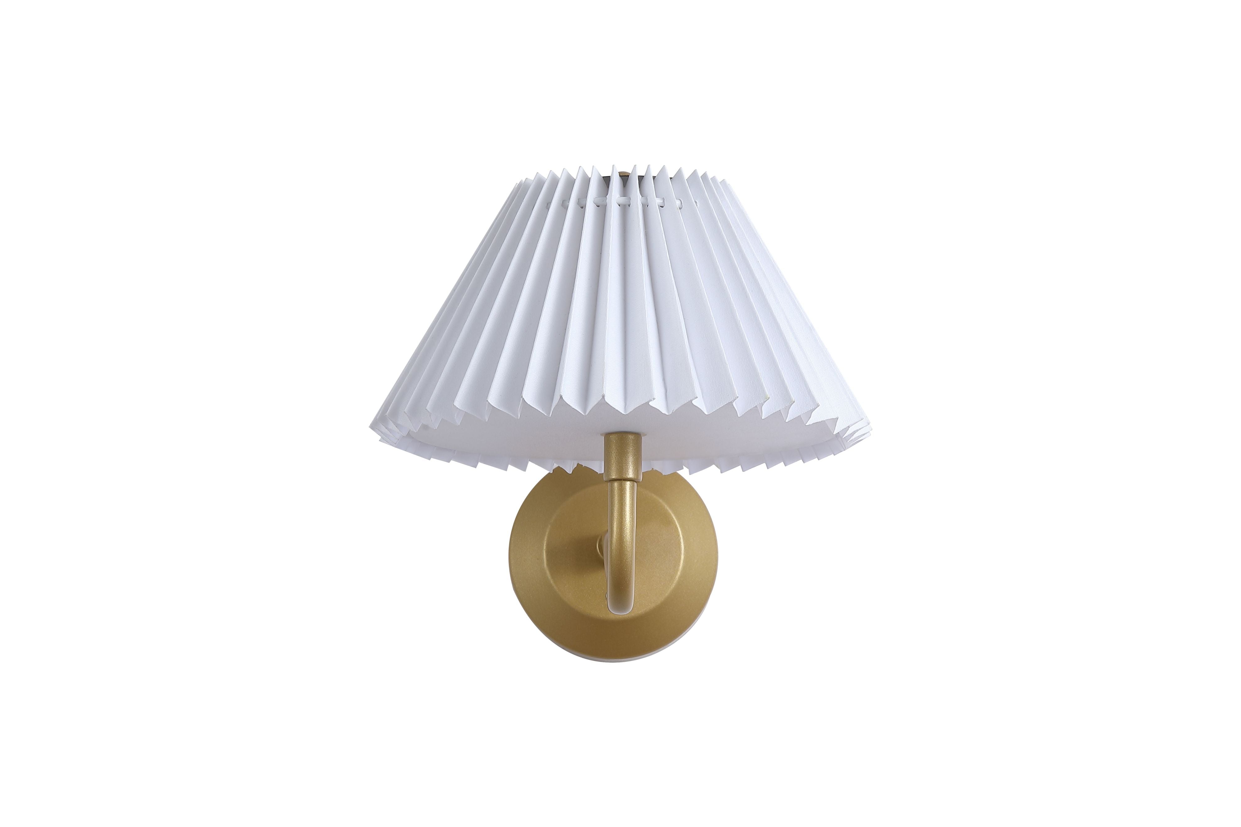 Straight on view of the gold Danish wall light showing the pleated white shade and curved arm, lit from within