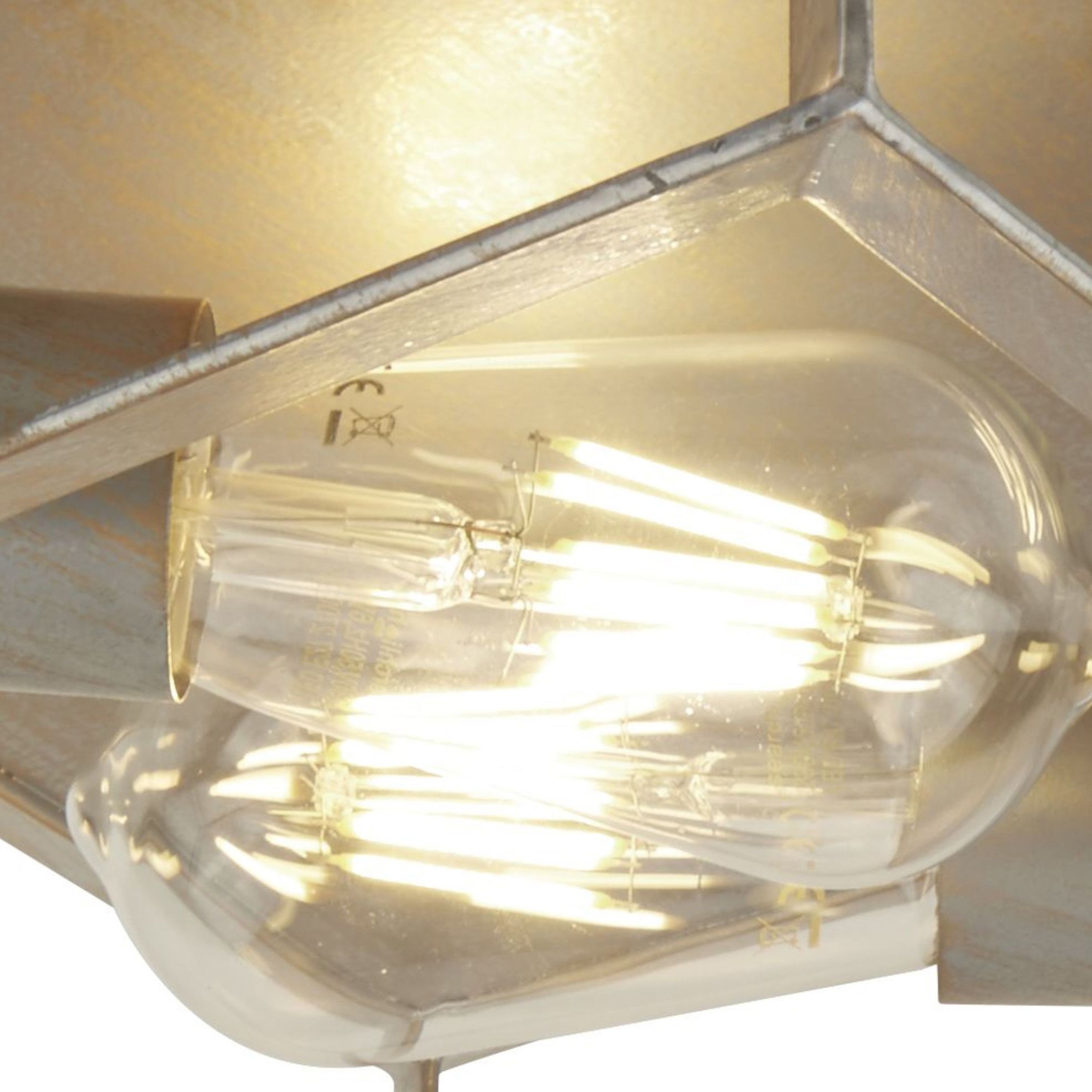 Close up of the two exposed filament bulbs inside the Searchlight Heaton 2 Light Flush ceiling fitting