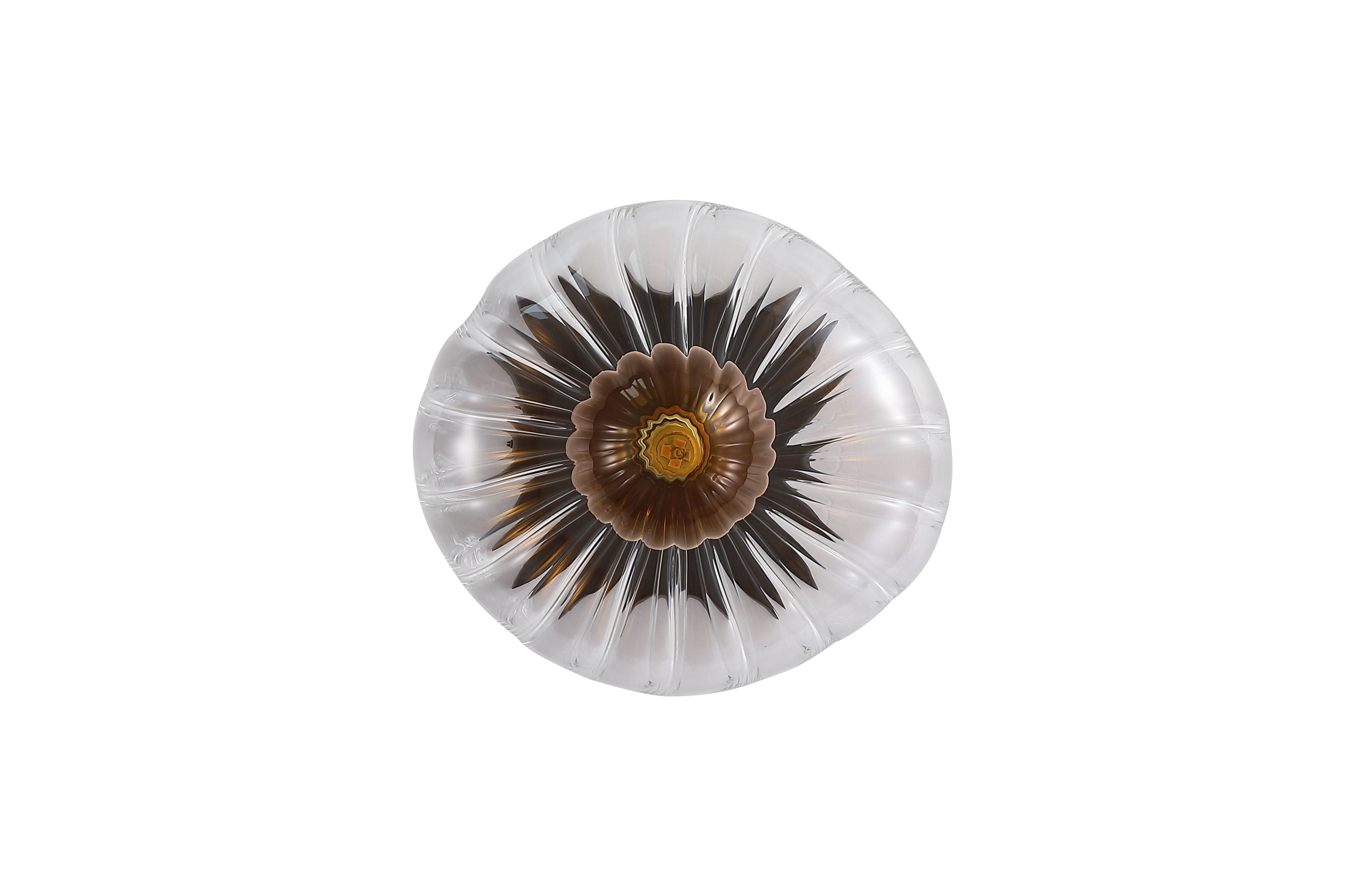 Searchlight Sunbeam 1 light wall light, straight on view showing deeper amber and bronze tones in the centre of the fluted glass when lit