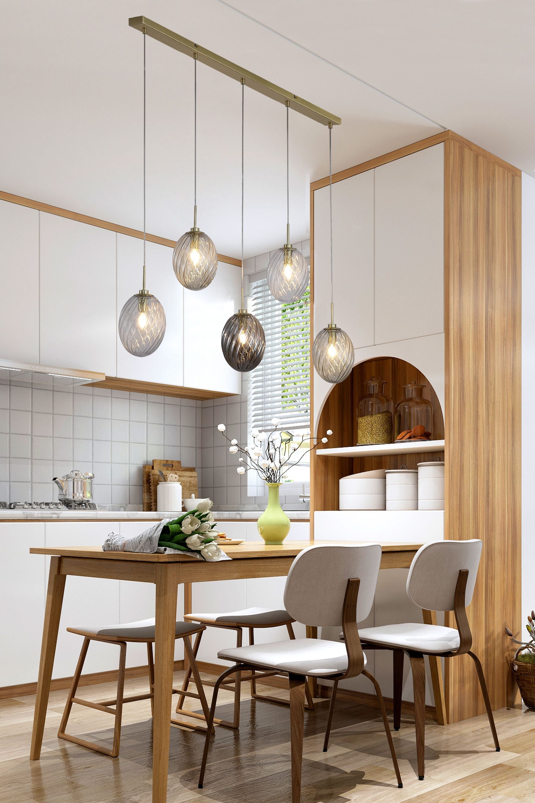 Whirl 5 Light Bar Pendant styled above a kitchen dining table in a wood and white kitchen
