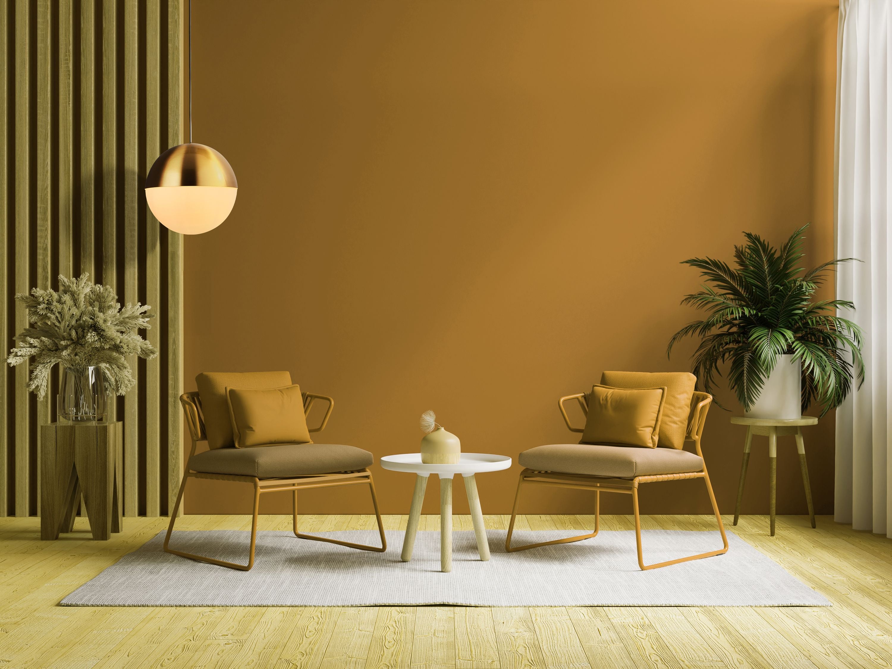 Endor Pendant hanging in a warm mustard coloured living room beside two armchairs and a round side table